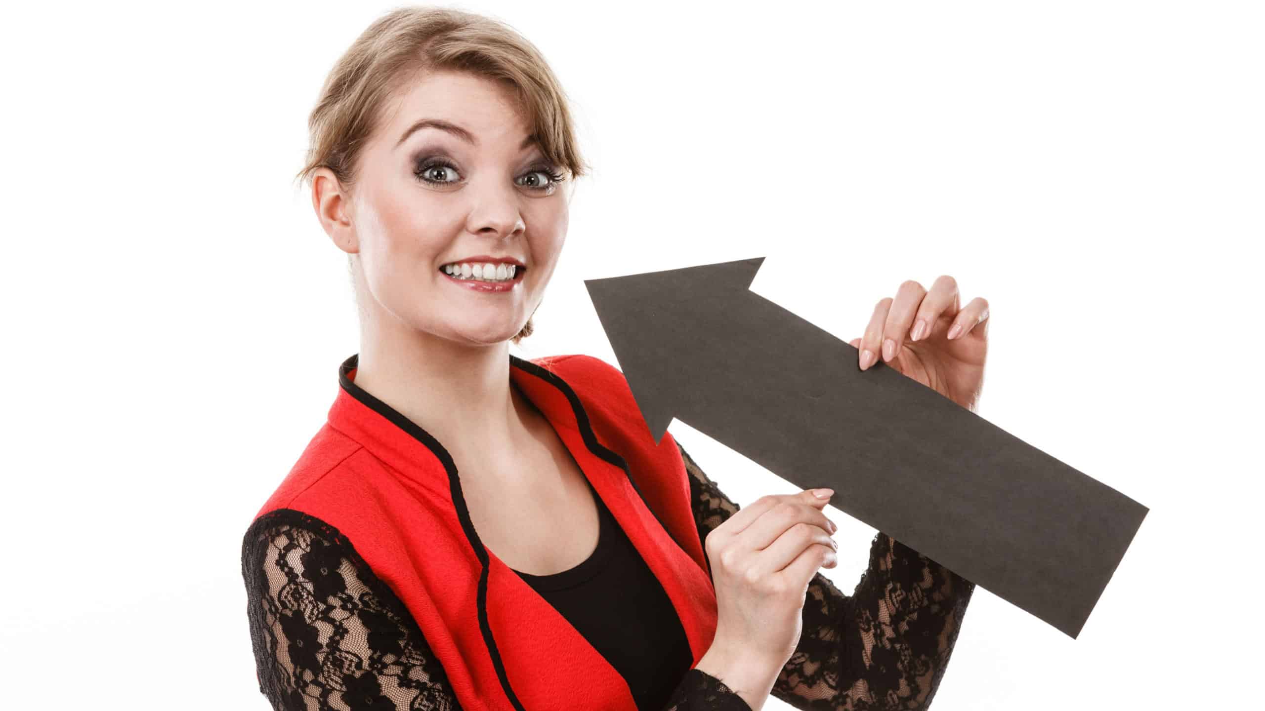 Psychology needs gesture symbol concept. Smiling girl seeking attention. Young lady holding arrow pointer pointing on herself.