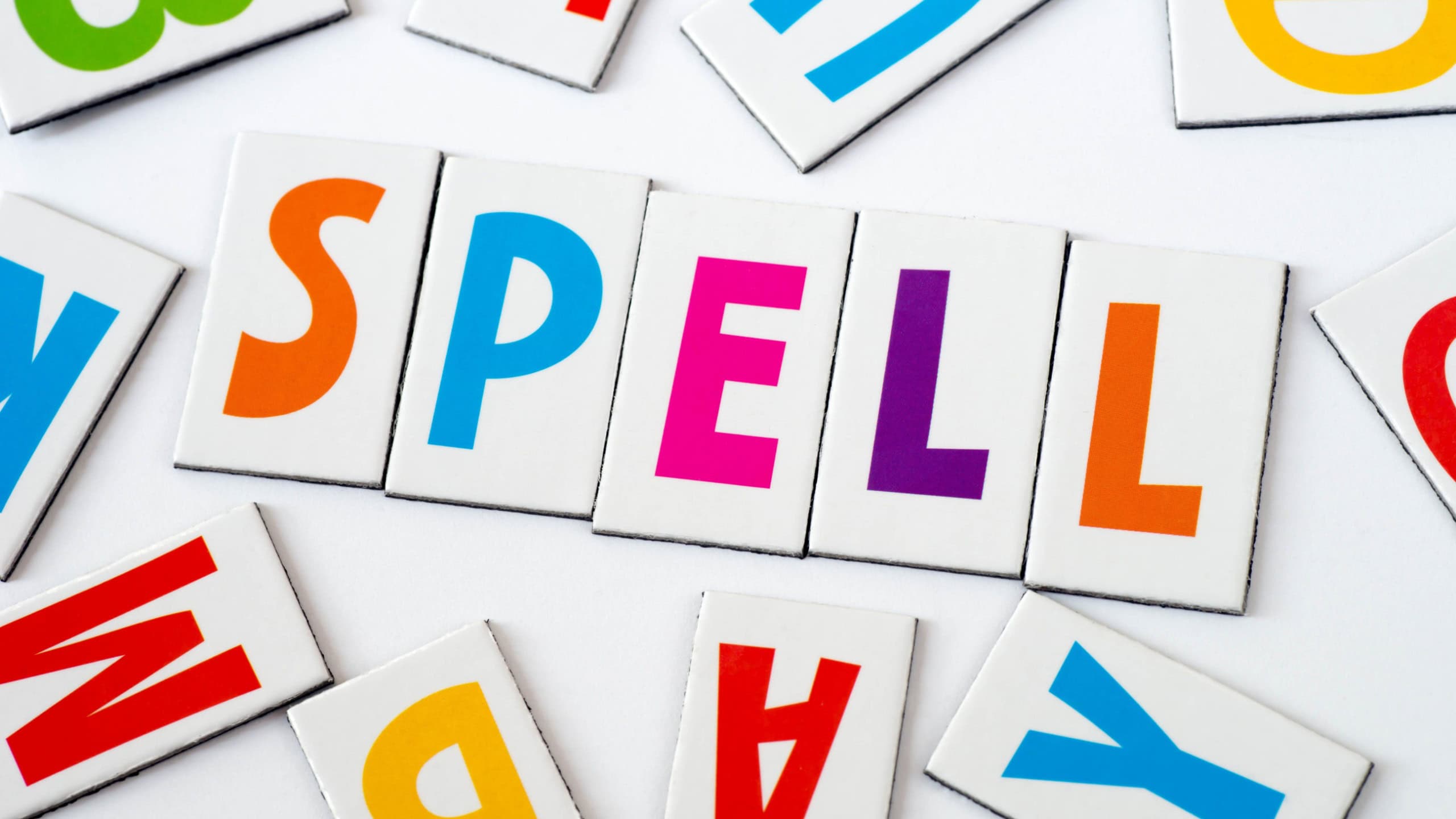 Word spell made of colorful letters on white background