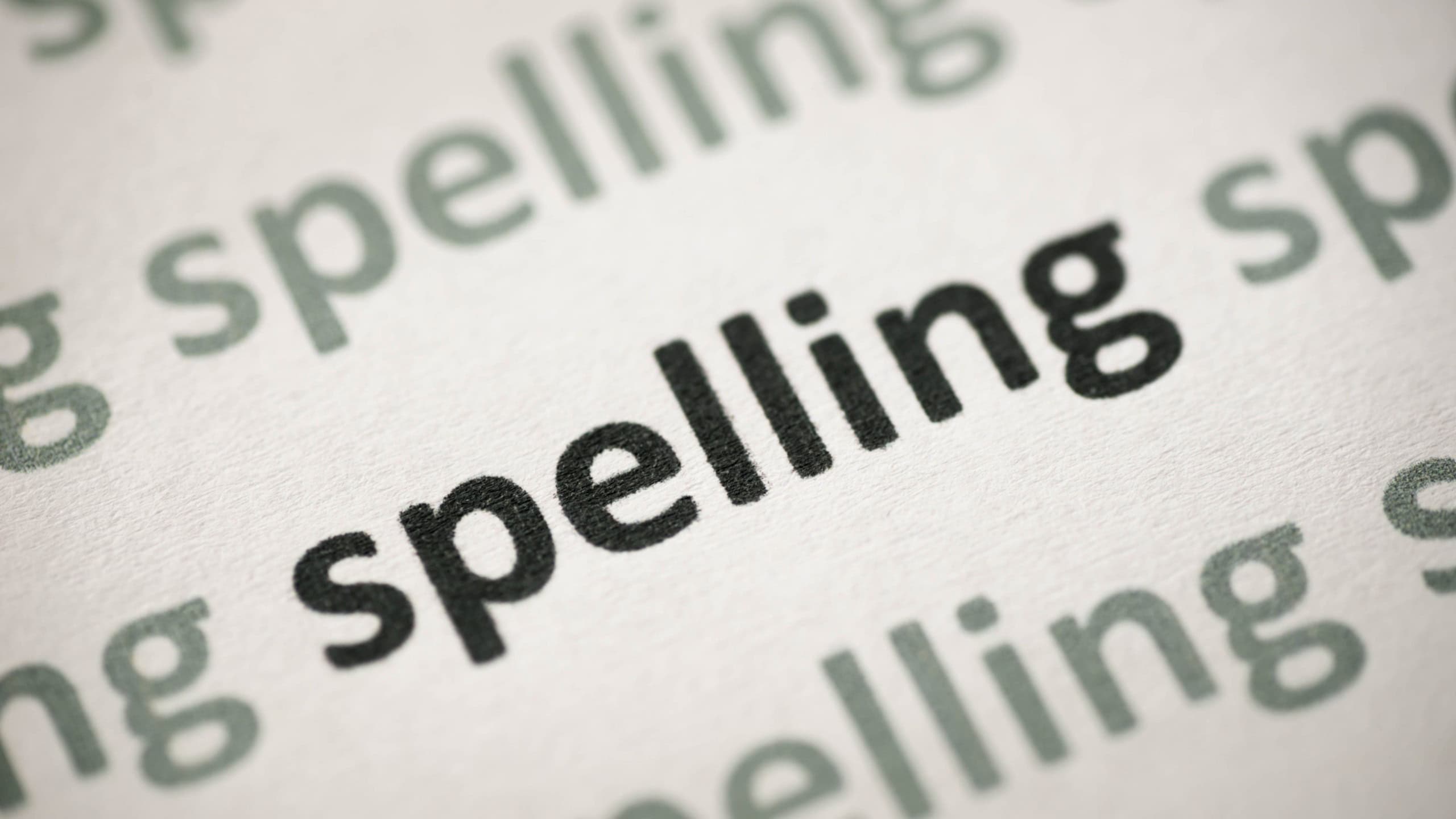 Word spelling printed on white paper macro
