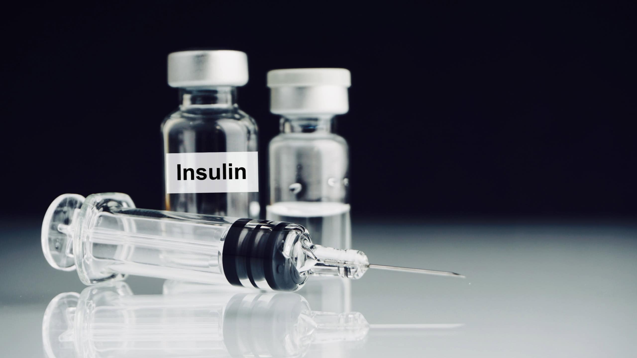 Syringe and vials with word Insulin. Medical and Healthcare Concept