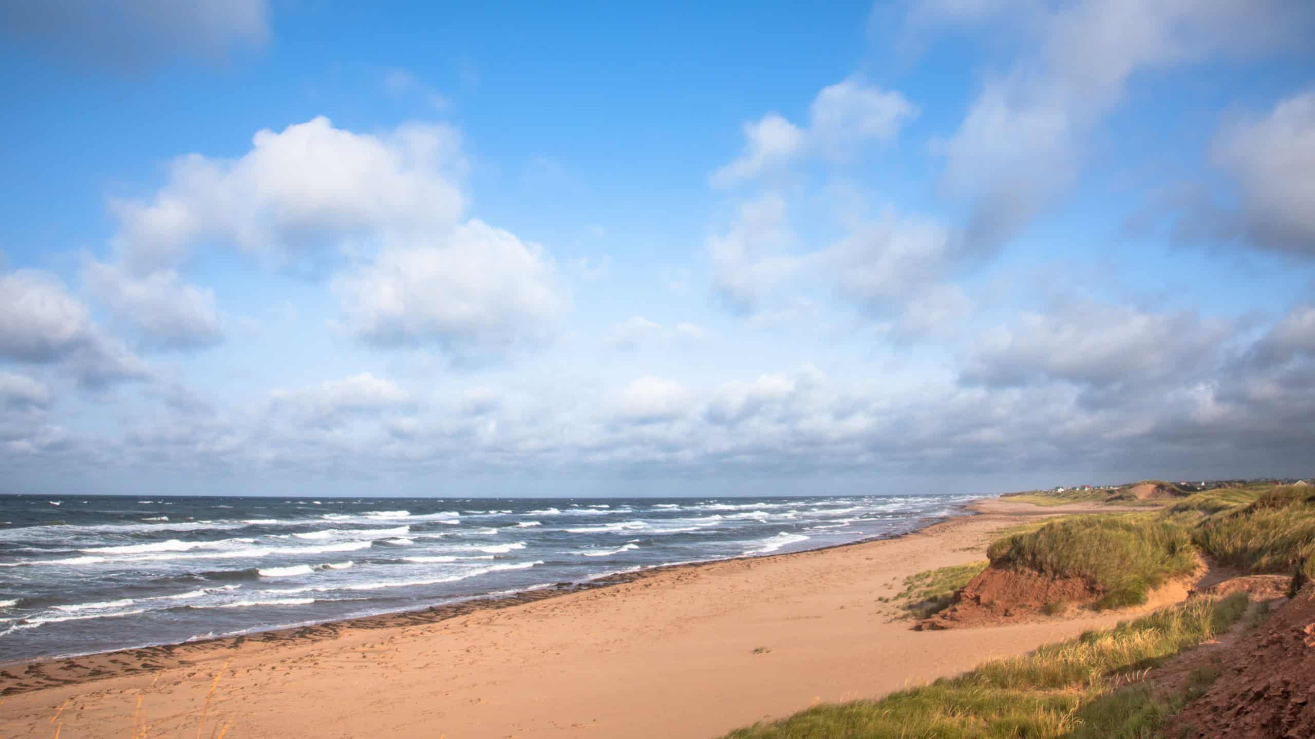 Deserted beach and choppy seas, Thunder Cove, Prince Edward Island, Canada.