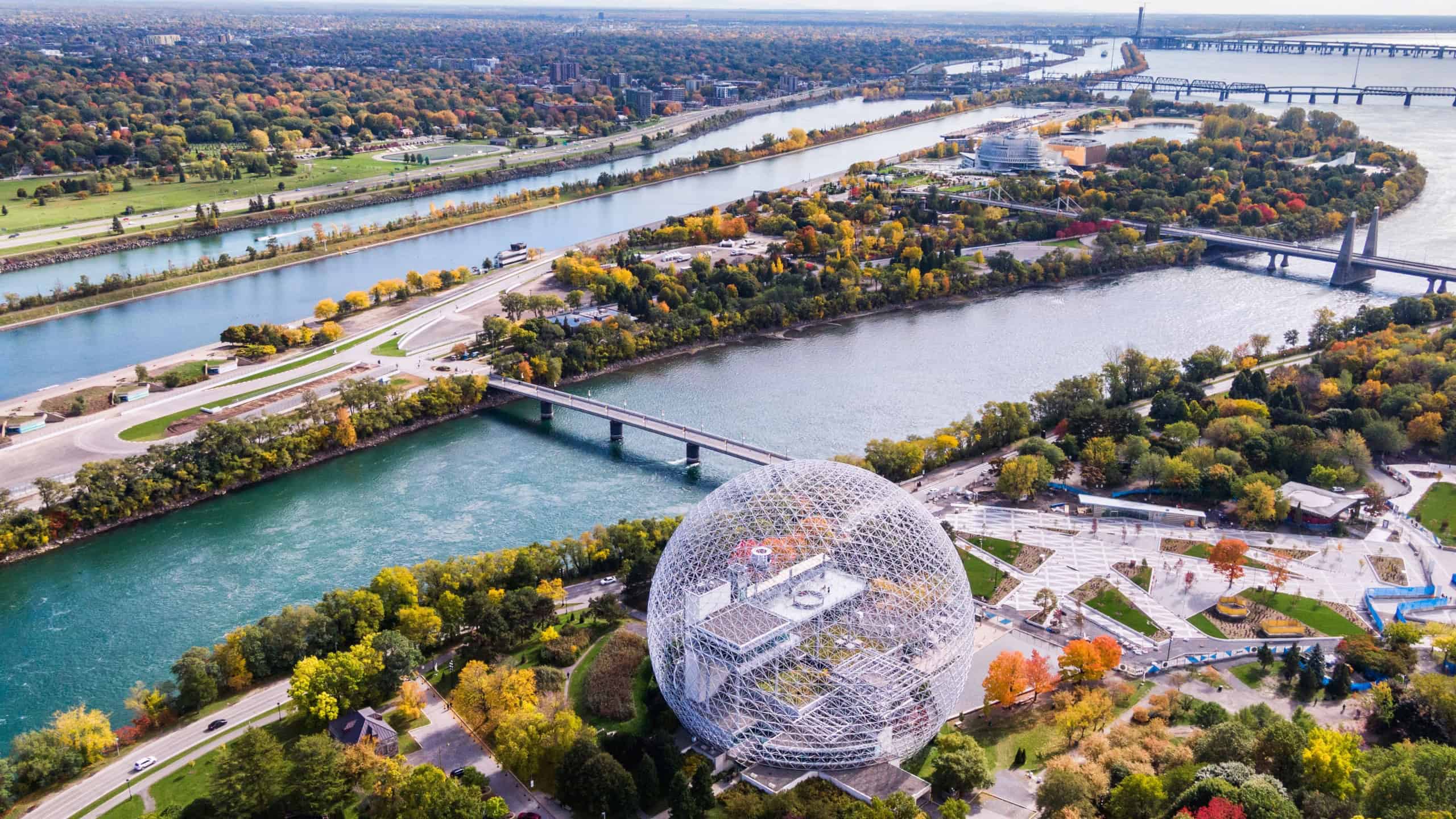 Montreal, Quebec, Canada, aerial view of Biosphere Environment Museum and Saint Lawrence river during fall season.