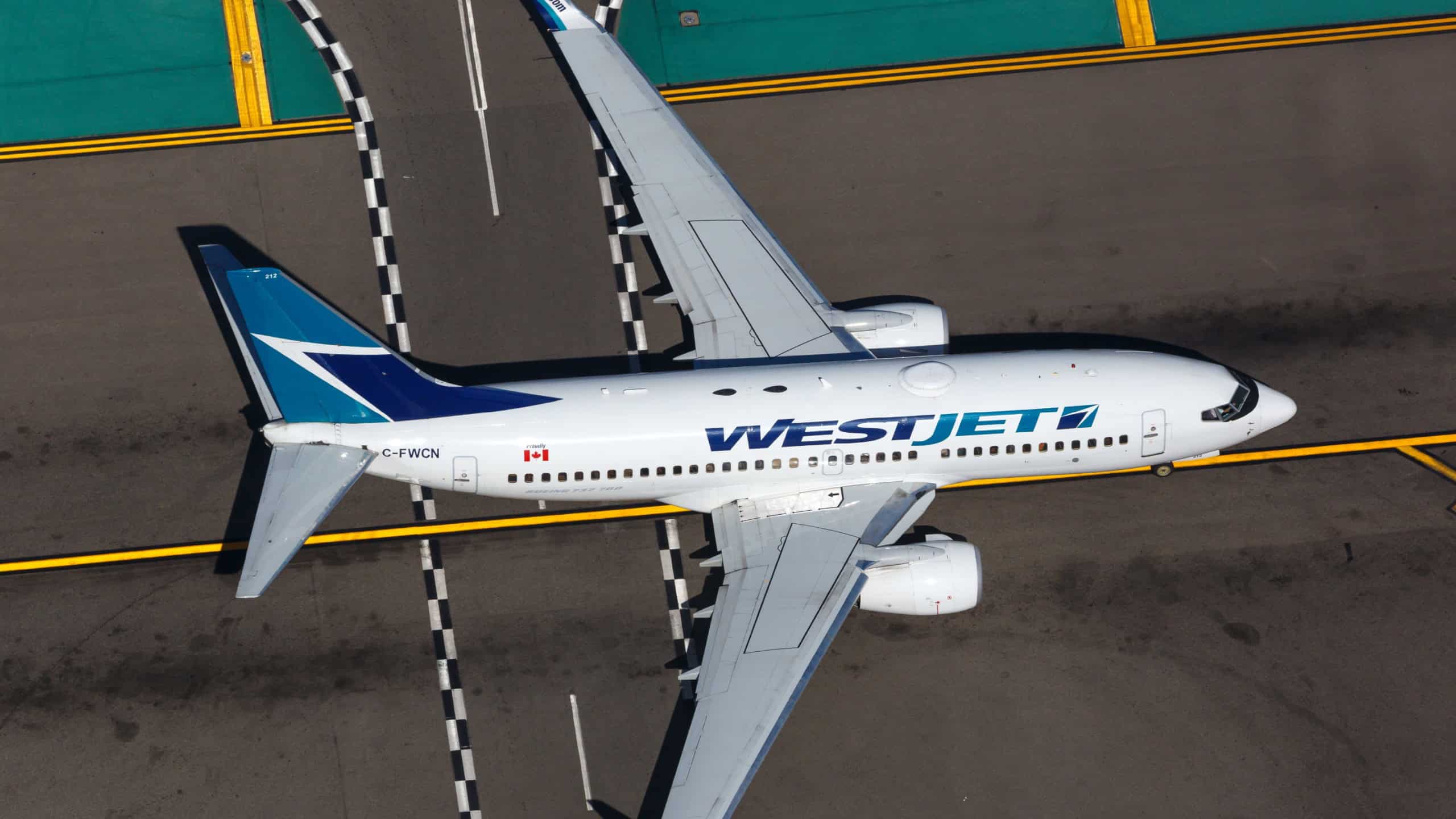  WestJet Boeing 737-700 at Los Angeles airport (LAX) in the USA. Boeing is an aircraft manufacturer based in Seattle, Washington.