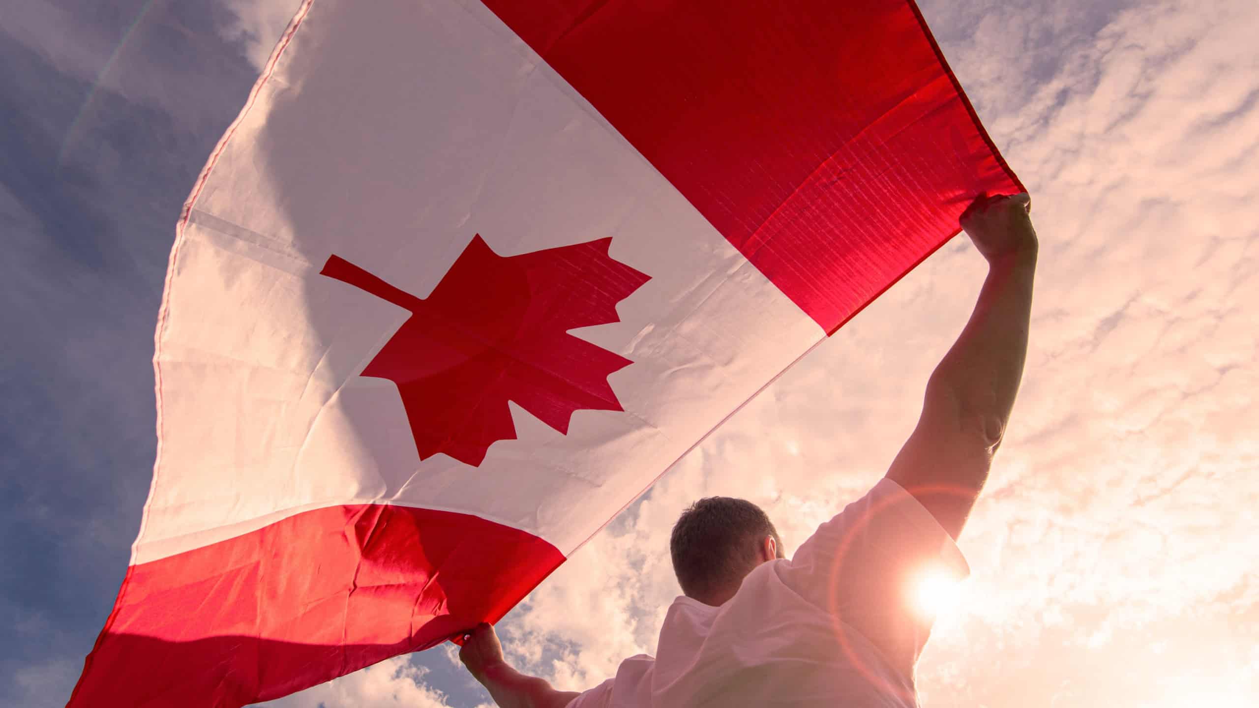 Man holding The National Flag of Canada