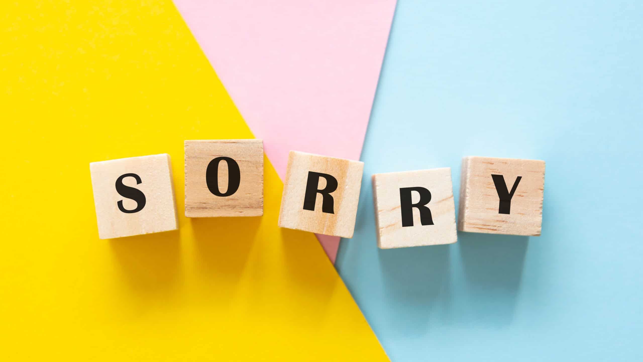 Sorry wordmade from wooden blocks colorful backgrounds
