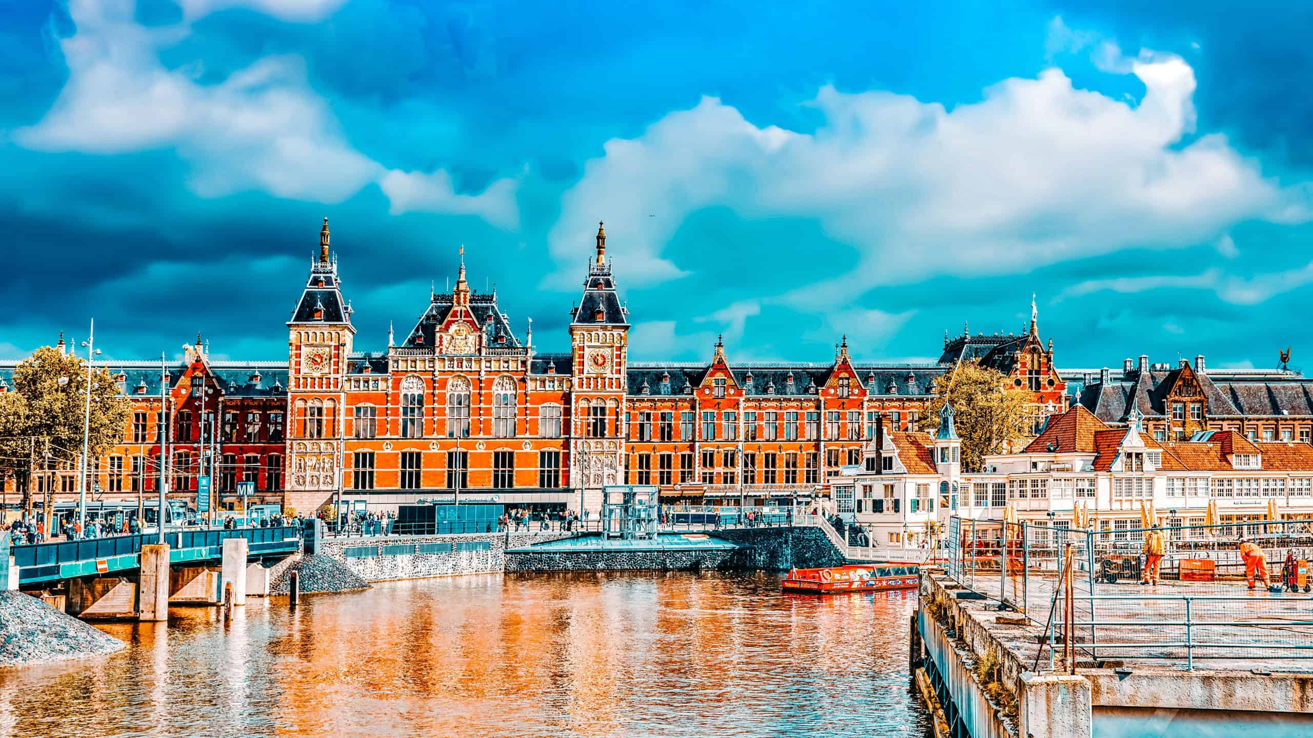 Beautiful buildings Amsterdam Central station.(Station Amsterdam Centraal). Amsterdam Centraal was designed by Pierre Cuypers, who is also known for his de