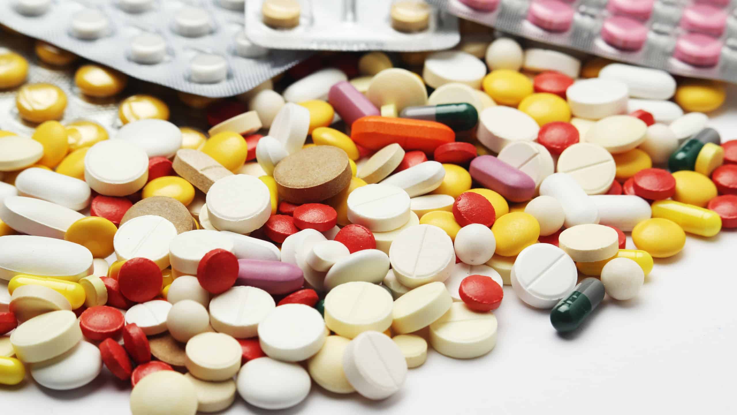 Different colorful tablets at white background