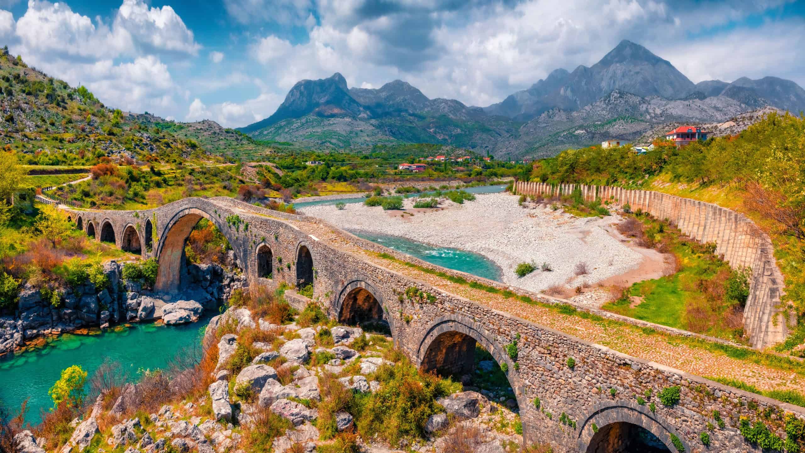Beautiful spring view of Old Mes Bridge. Colorful morning landscape of Shkoder. Amazing outdoor scene of Albania, Europe. Traveling concept background.