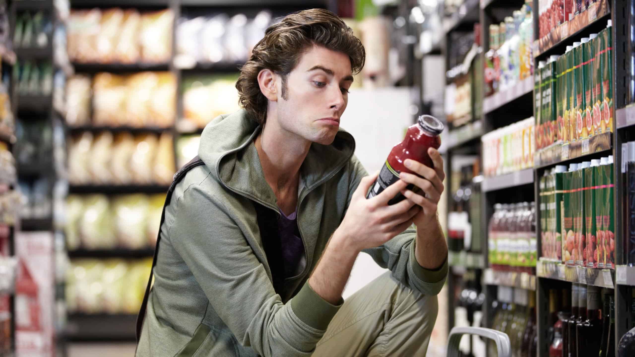 I feel like trying something new today. A young man considering an impulse purchase.