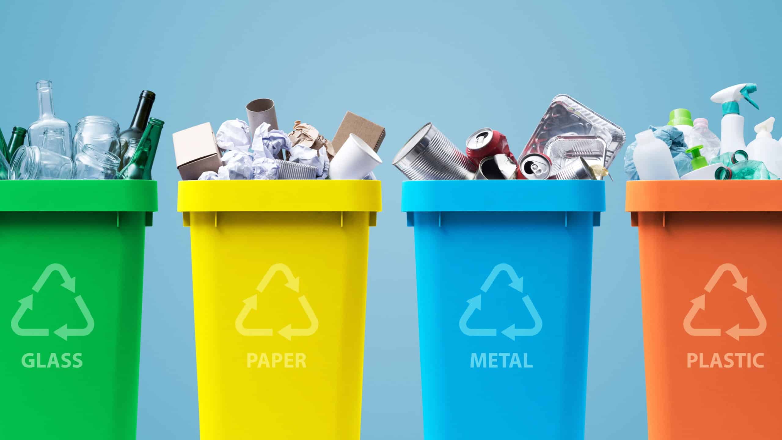 Collection of waste bins full of different types of garbage, recycling and separate waste collection concept