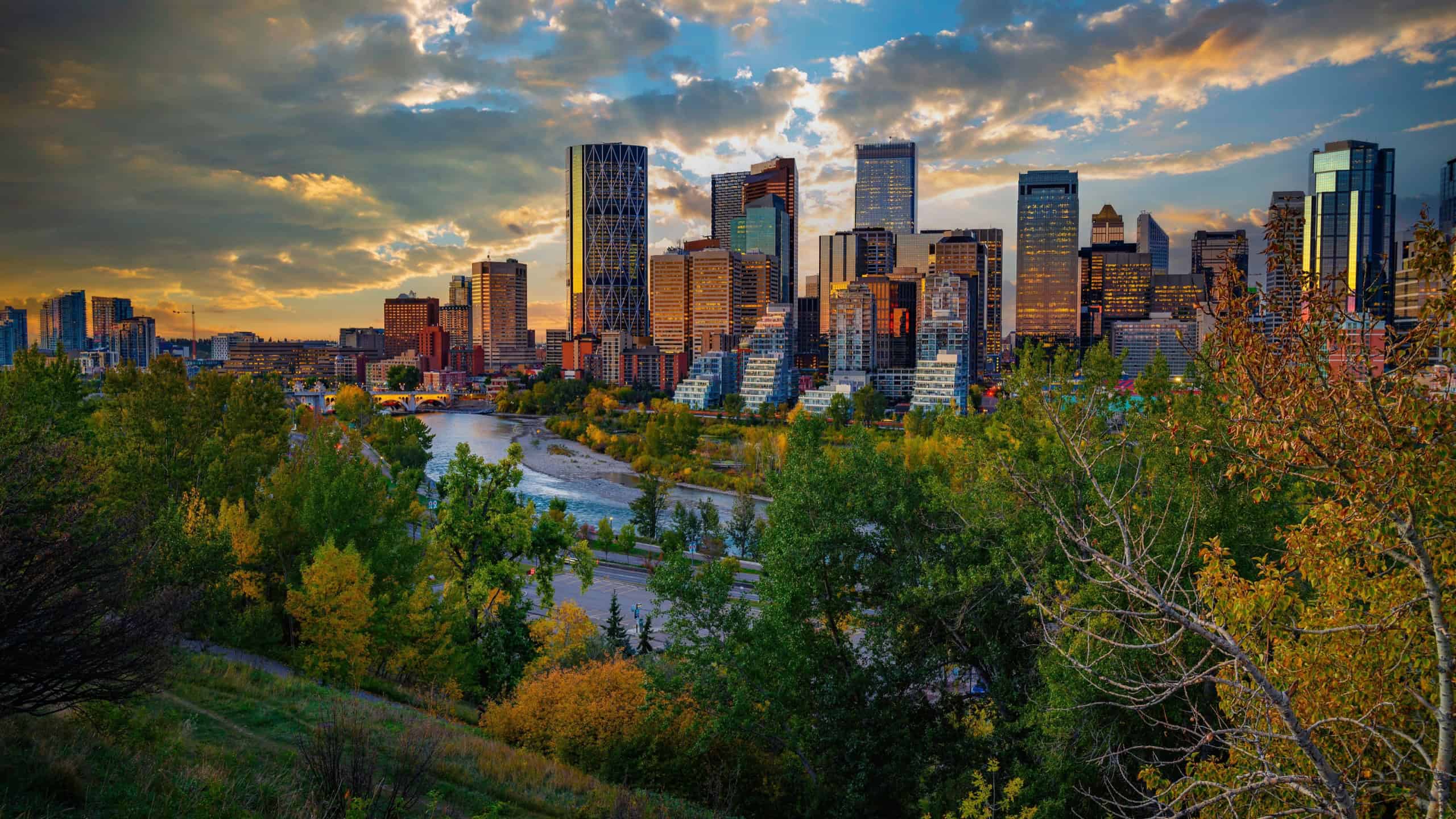 Sunset above city skyline of Calgary with Bow River, Alberta, Canada.