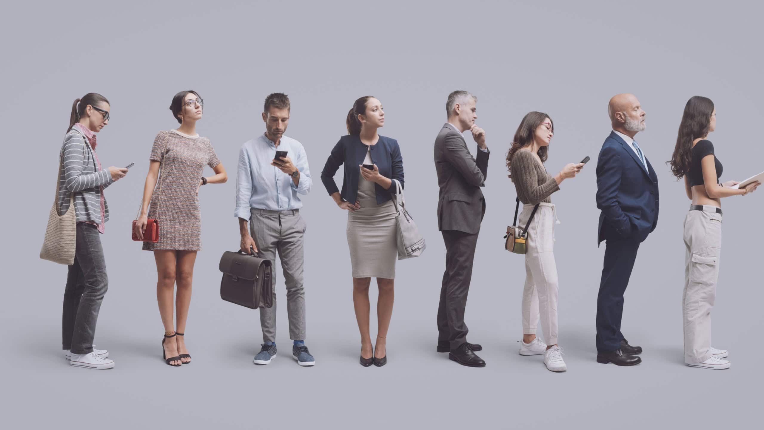 Diverse people standing and waiting patiently in line, isolated on gray background