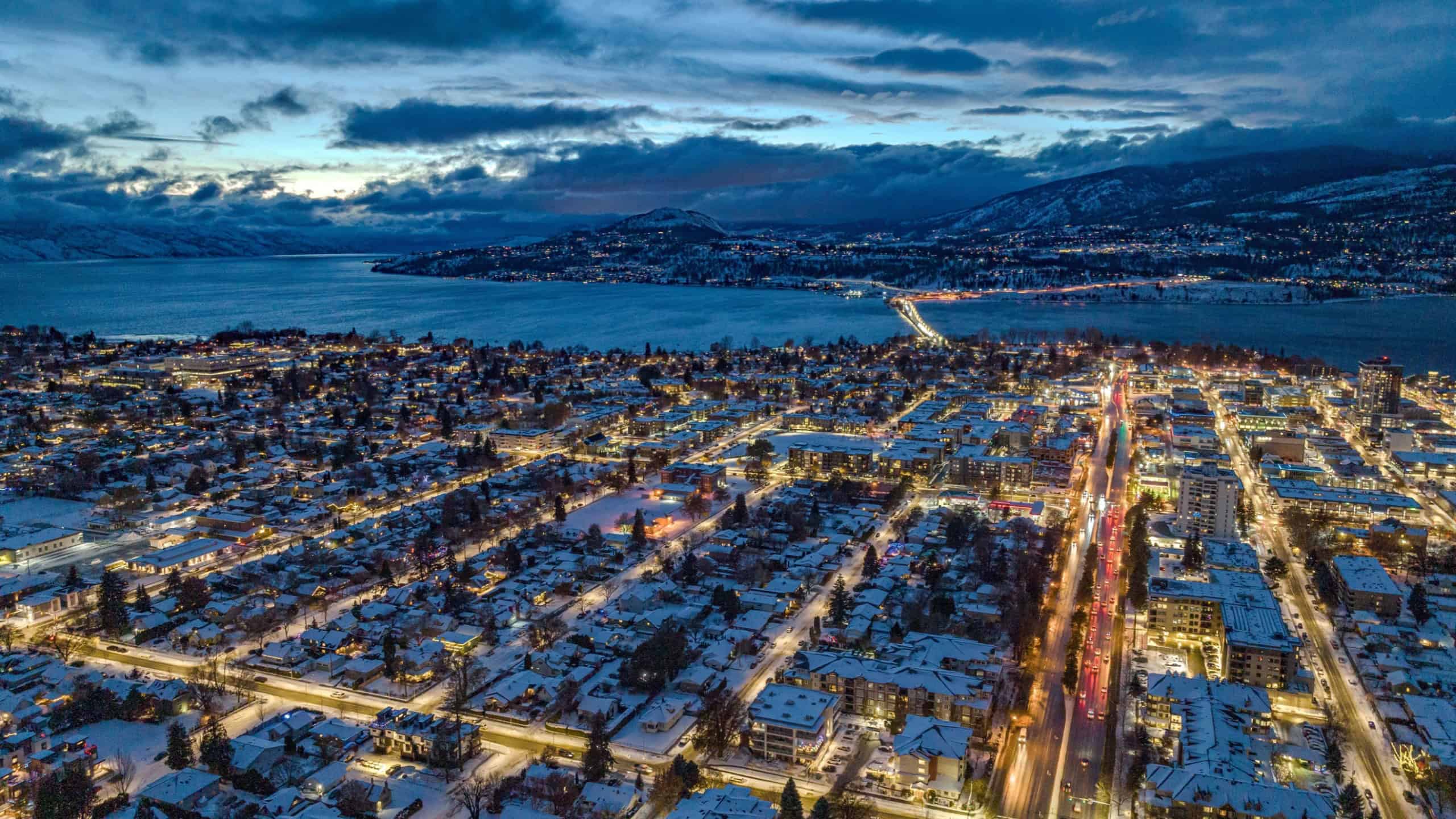 A drone shot of buildings in Kelowna, British Columbia, Canada in the evening