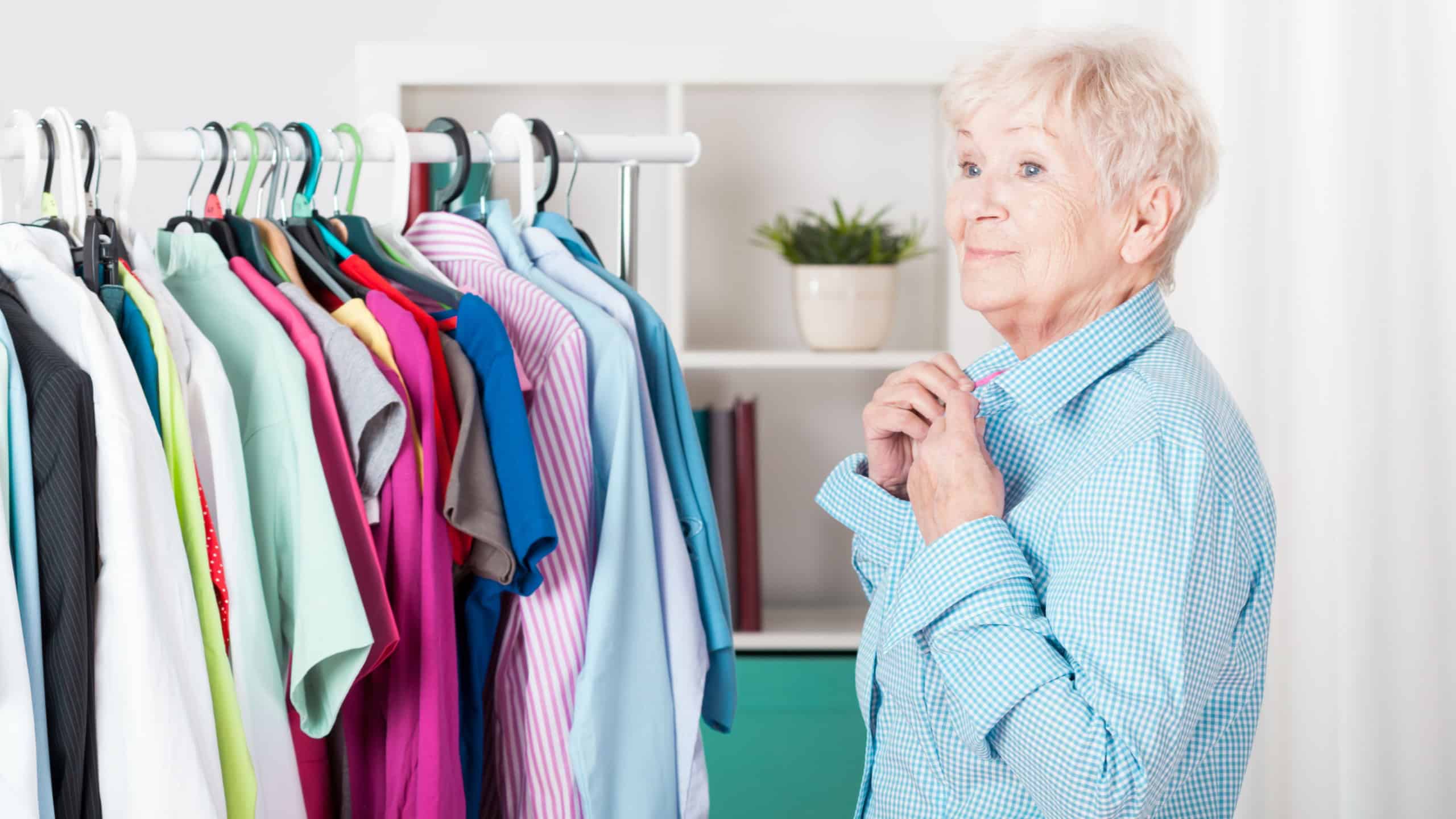 Older elegant lady dressing the shirt