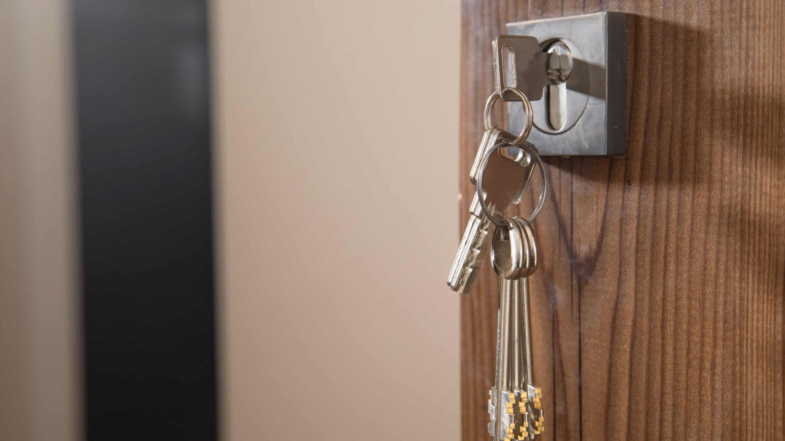 House keys on the door. Security. Real estate