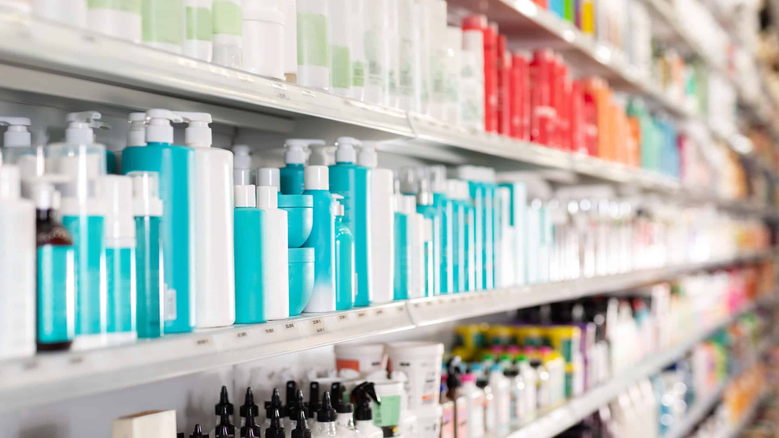 Various of haircare cosmetics for sale on shelves of cosmetic store