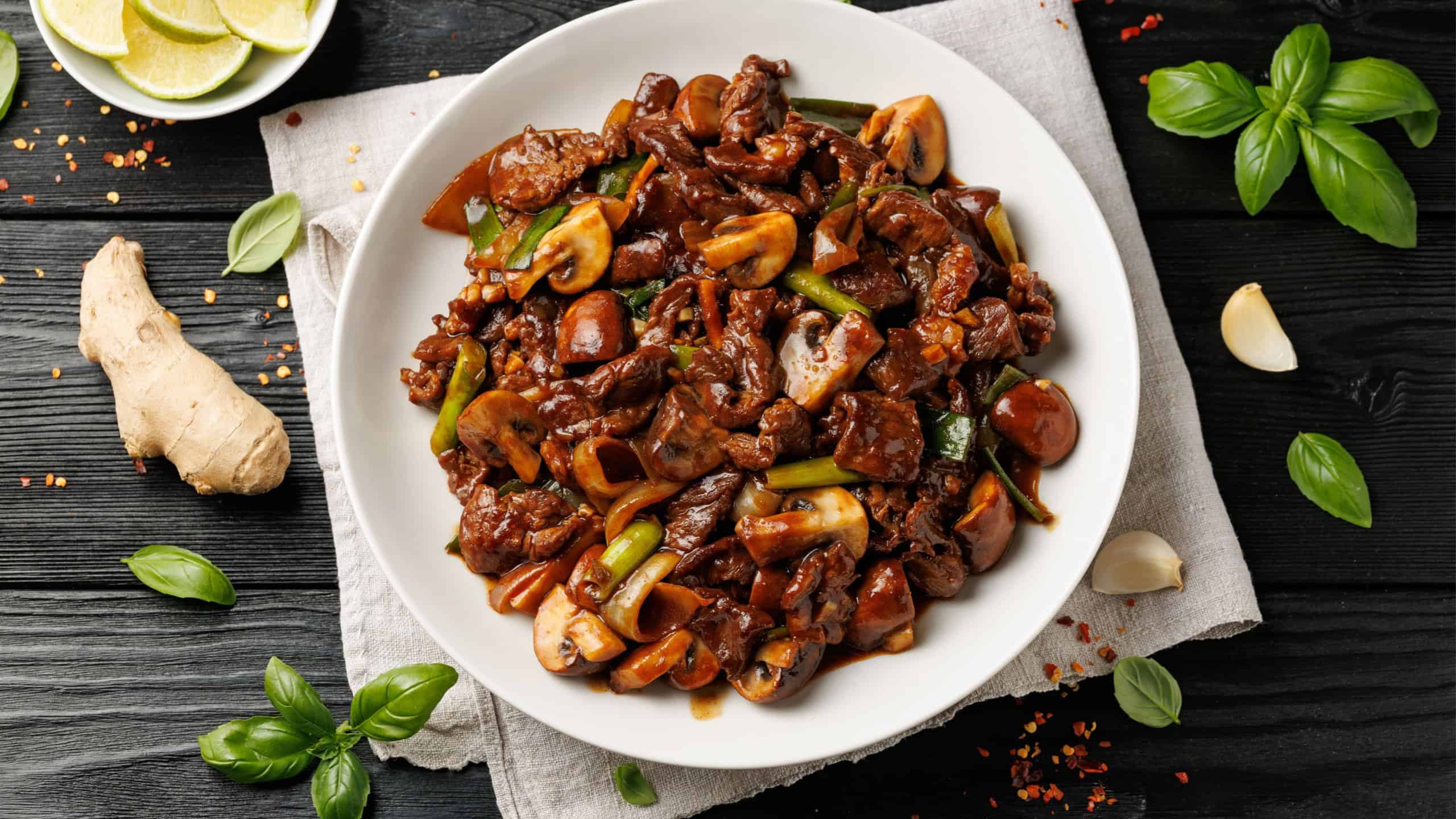 Beef Mushroom Stir Fry with ginger and garlic in a white plate