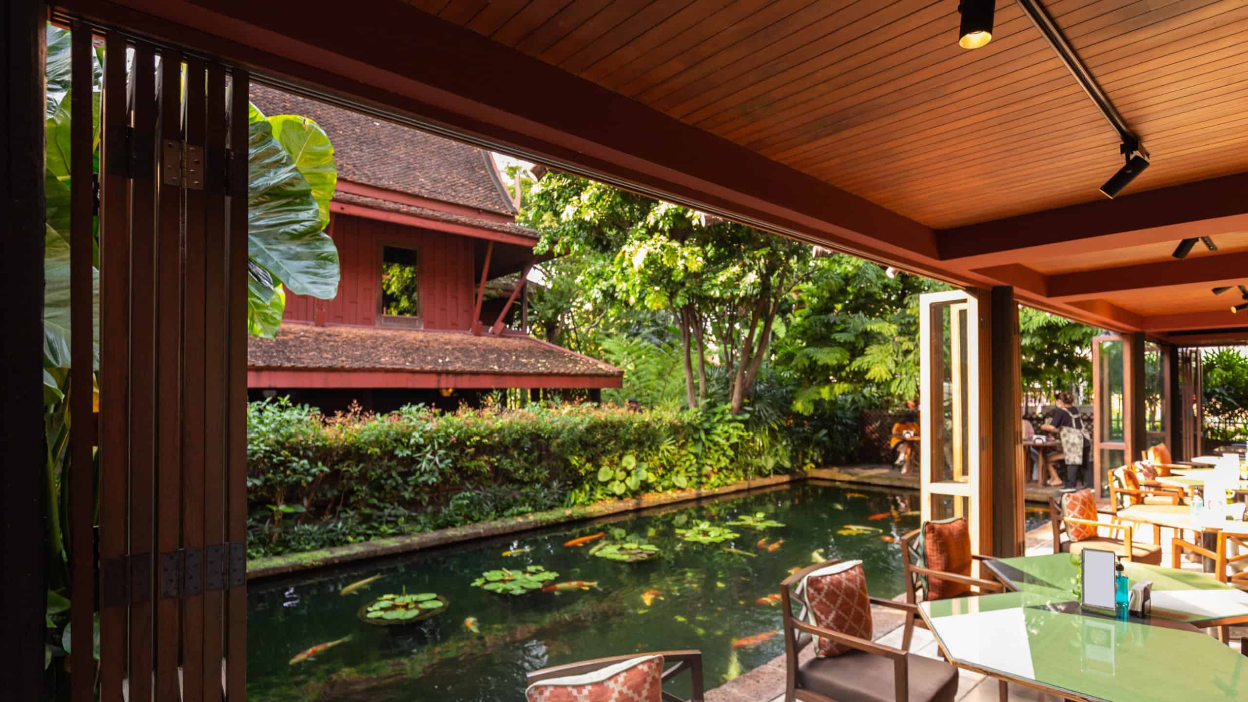 A view of Jim Thompson's house and koi pond from an open-air cafe