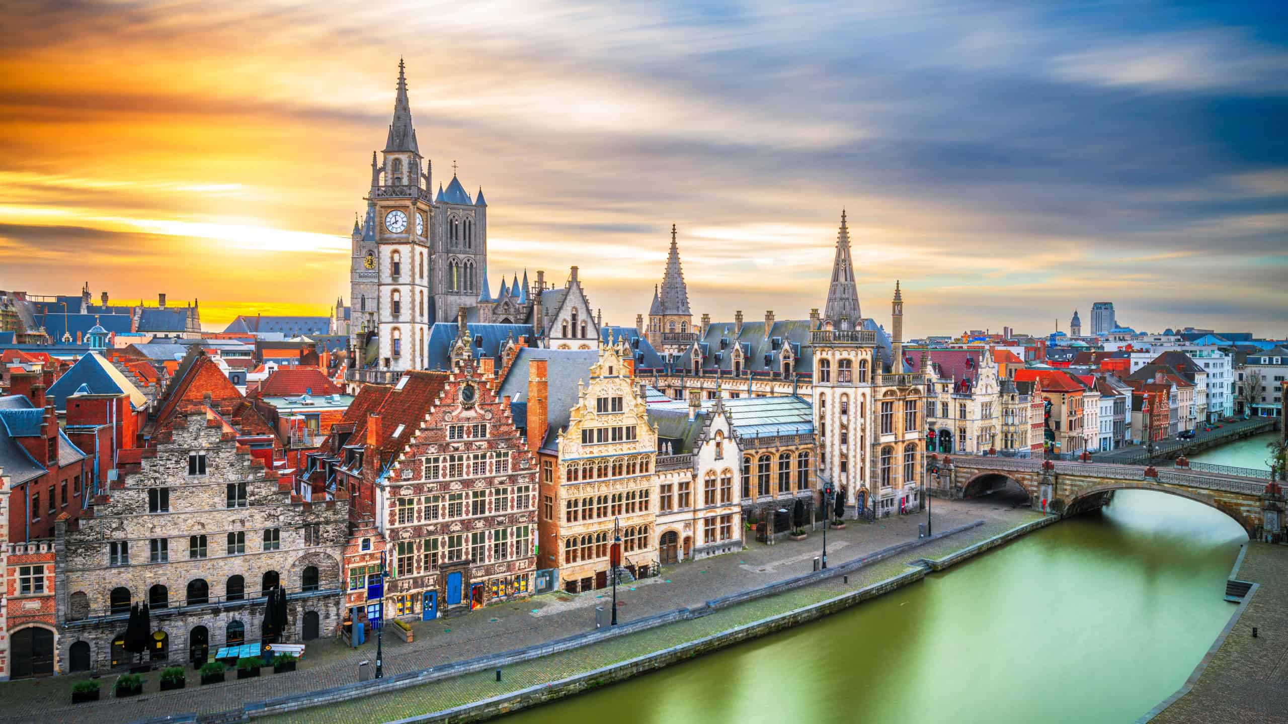 Ghent, Belgium old town cityscape from the Graslei area at dawn.