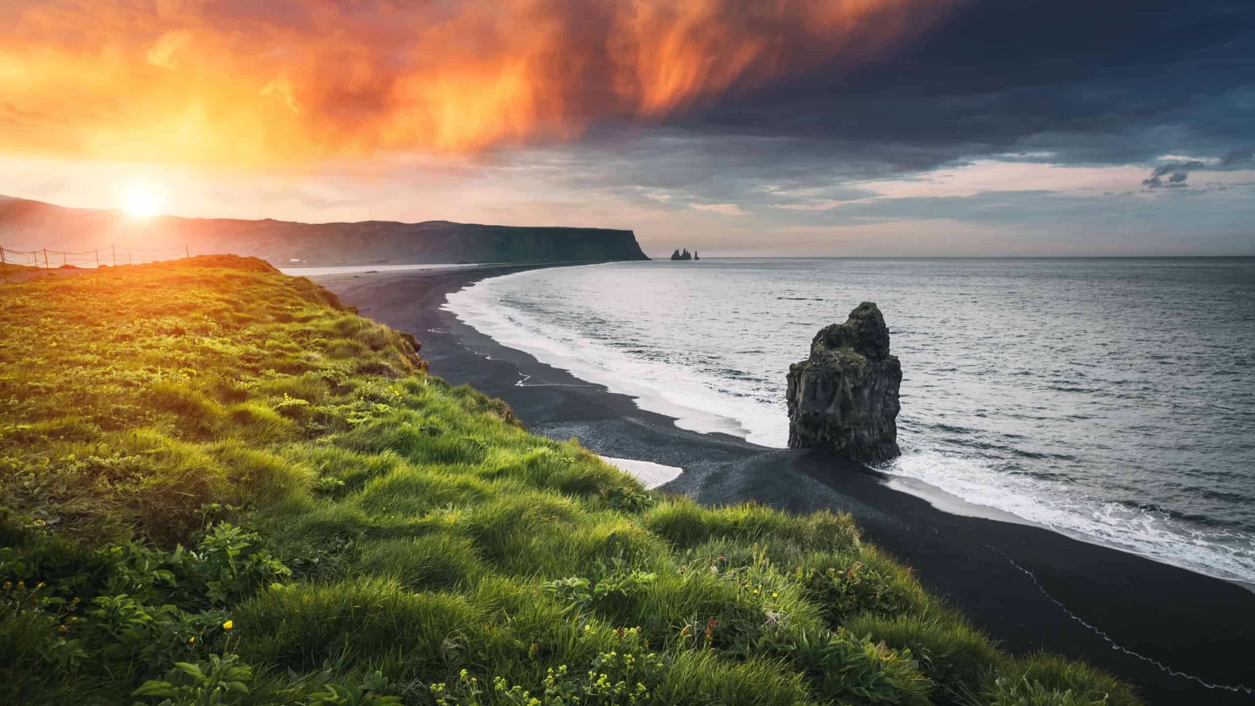 Kirkjufjara black sand beach and Arnardrangur is a top attraction South Coast of Iceland. Location place Sudurland region Iceland, Europe. Popular tourist destination. Discovery the beauty of earth.