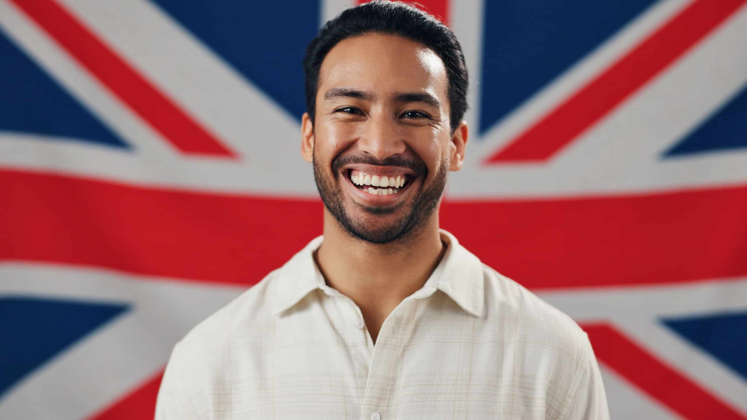 British flag, patriot and portrait of happy man with pride, confidence and country loyalty. Britain, heritage and person laughing with United Kingdom symbol for nationality, citizenship or patriotism