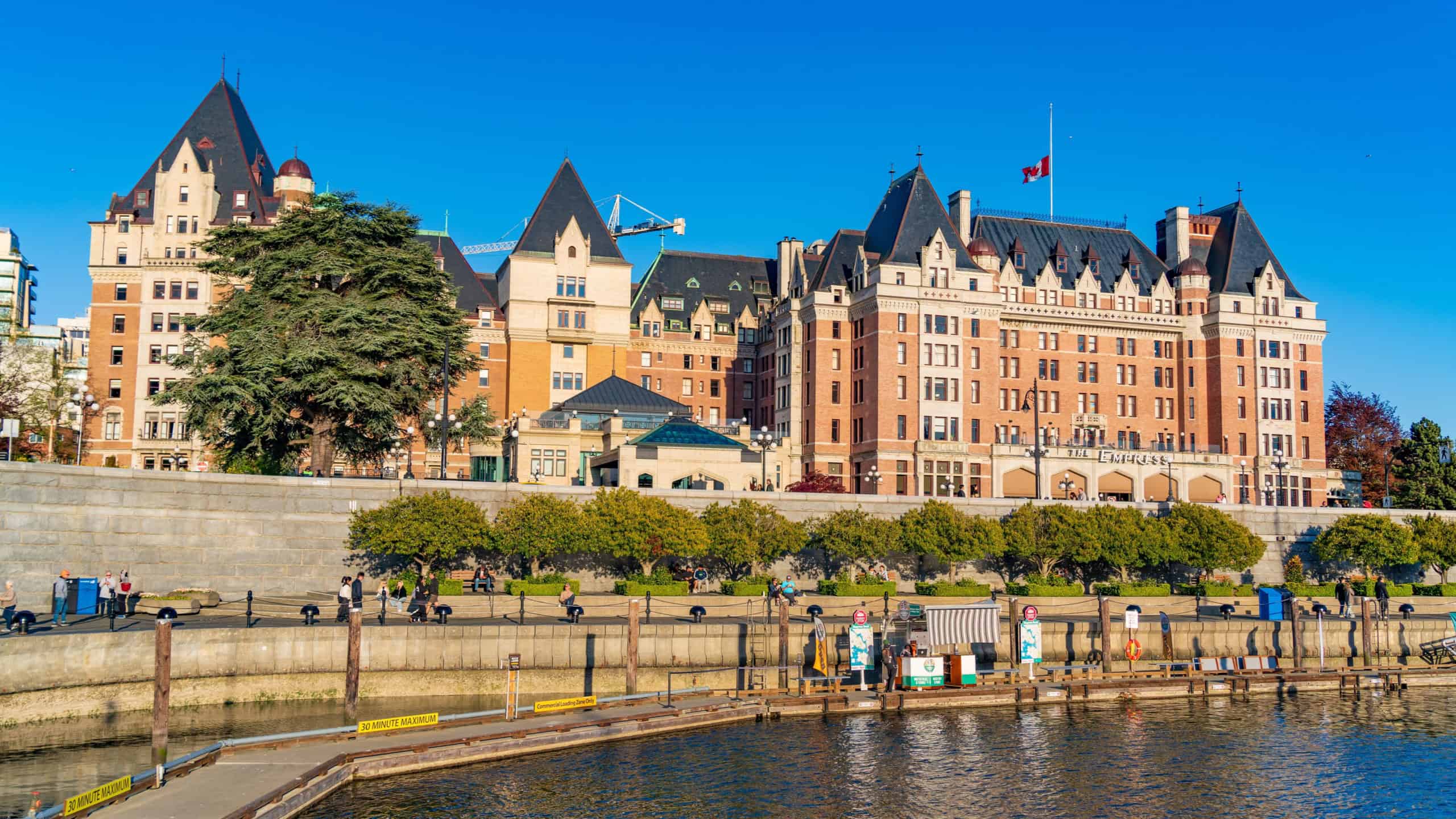 Victoria, Canada - May 03 2025: Fairmont Empress Hotel and Inner Harbour in Victoria, Canada