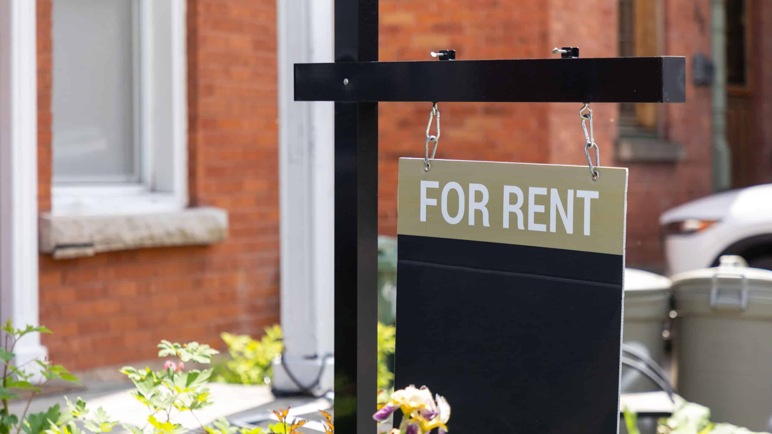 For rent sign in front of a residential building. Real estate business