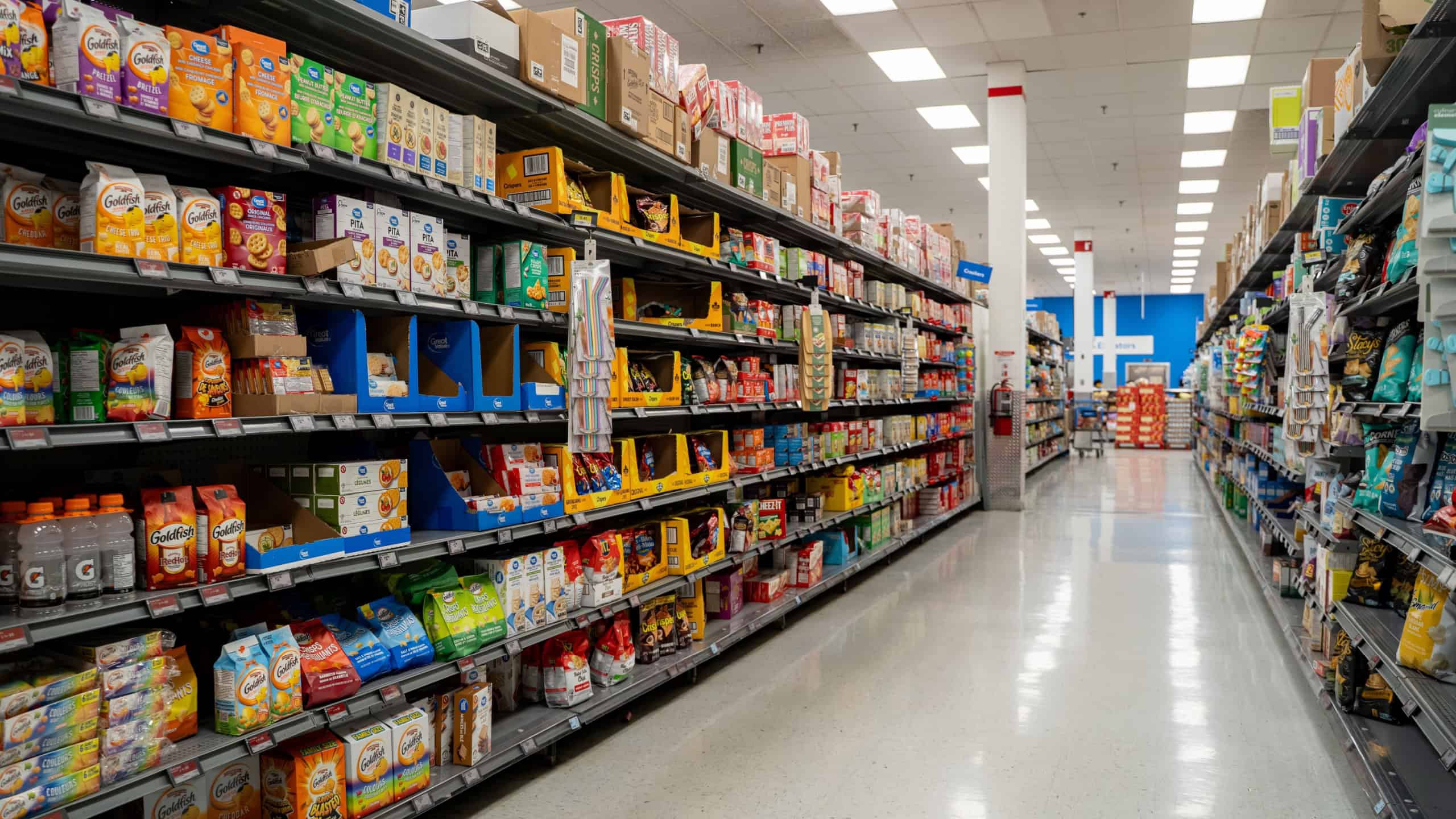 Grocery aisle with assorted packaged snacks and drinks. Toronto, Canada - October 3, 2025.
