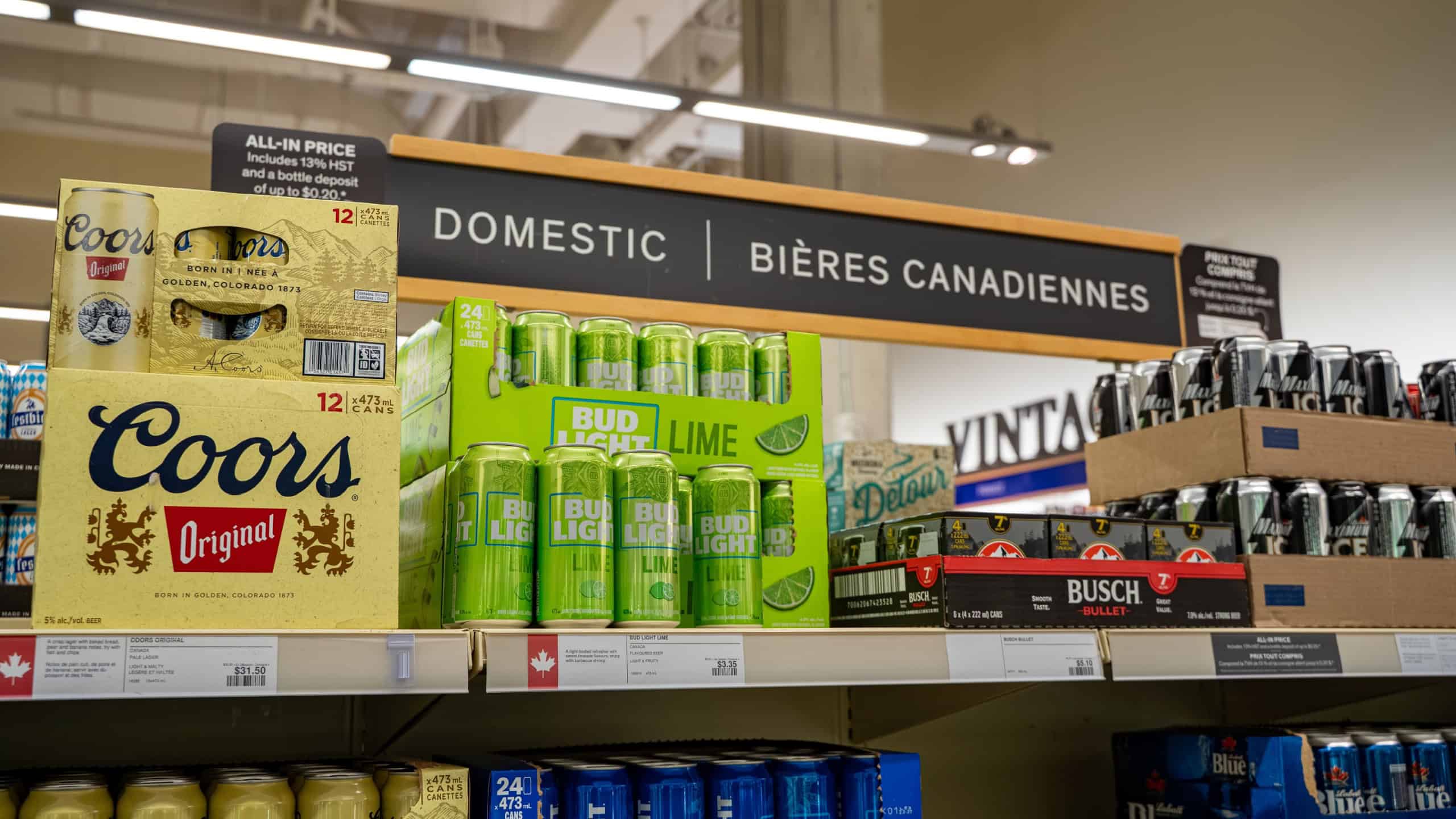 View of assorted beer cans on store shelf. Toronto, Canada - November 20, 2025.
