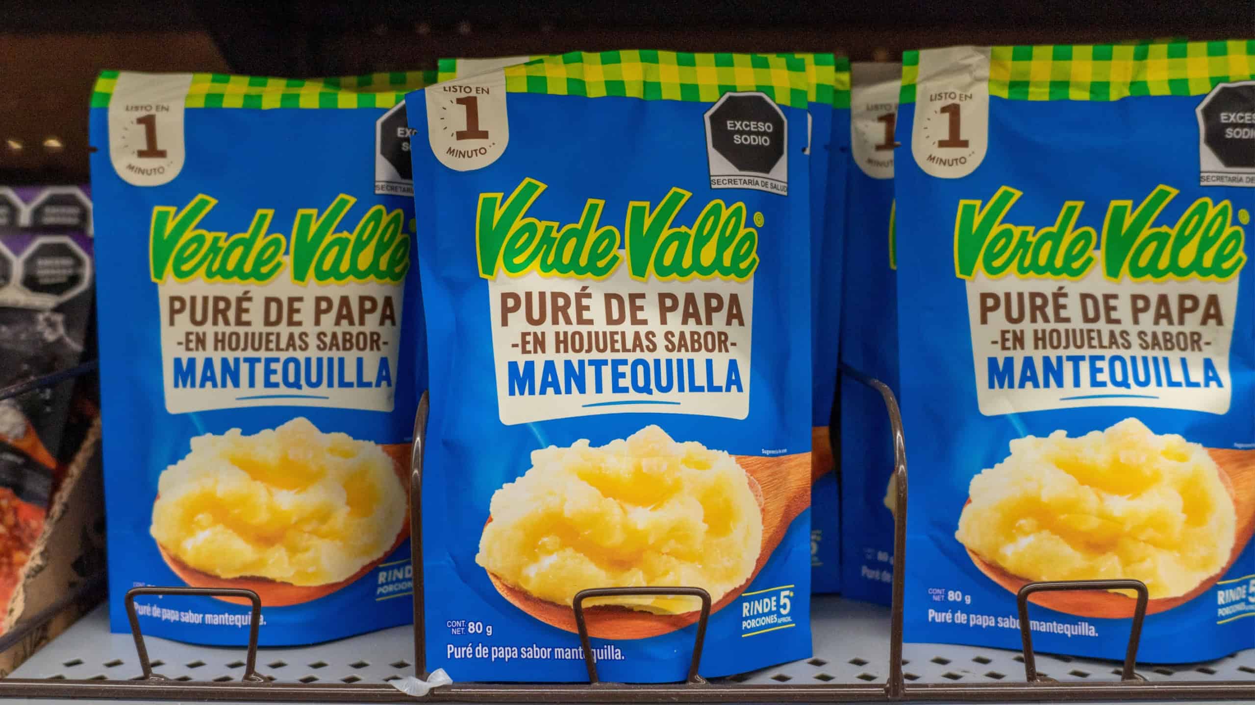 Villa de Alvarez, Colima. Mexico. April 14, 2026: Vibrant Blue Packaging of Verde Valle Butter Flavored Potato Puree Ready to Eat