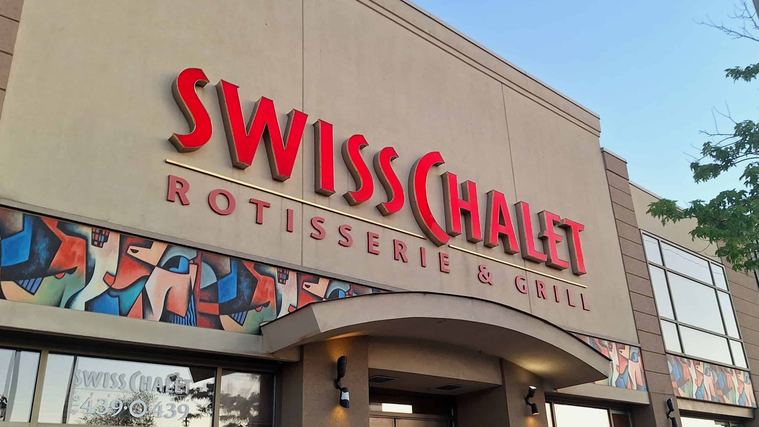The exterior facade of a popular Canadian rotisserie restaurant - Swiss Chalet 