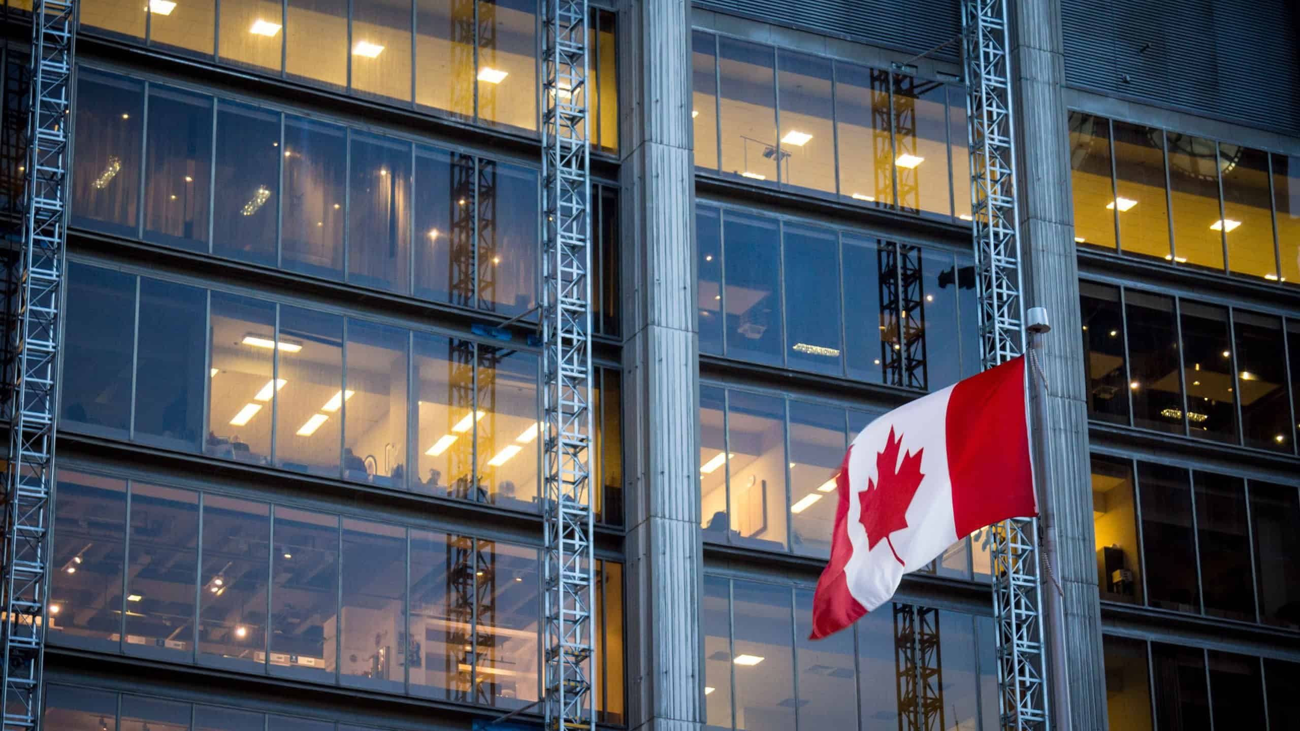 Canadian flag in front of a business building in Toronto, Ontario, Canada