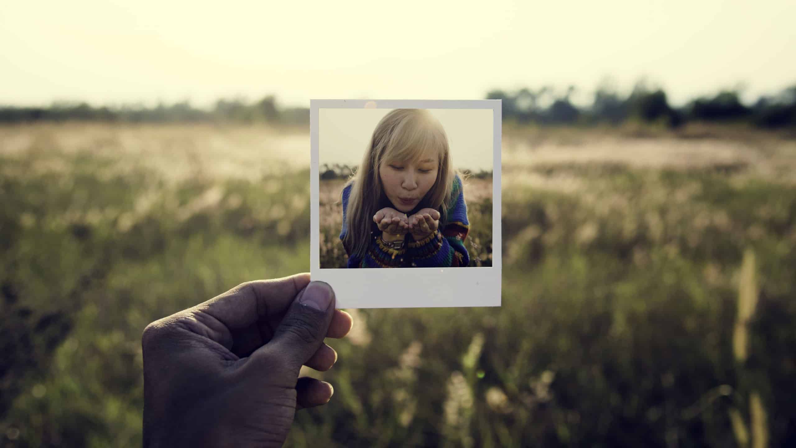 Woman with frame portrait with nature