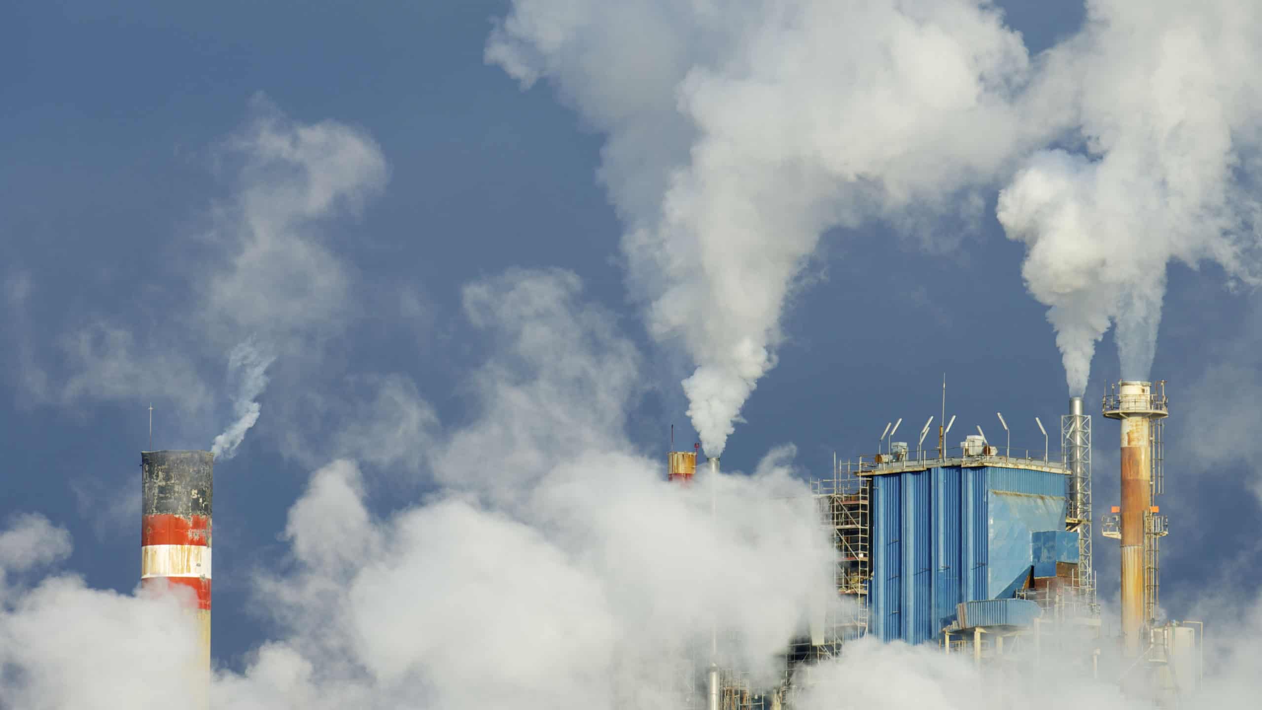 Smoke produced by the smokestacks of a paper mill