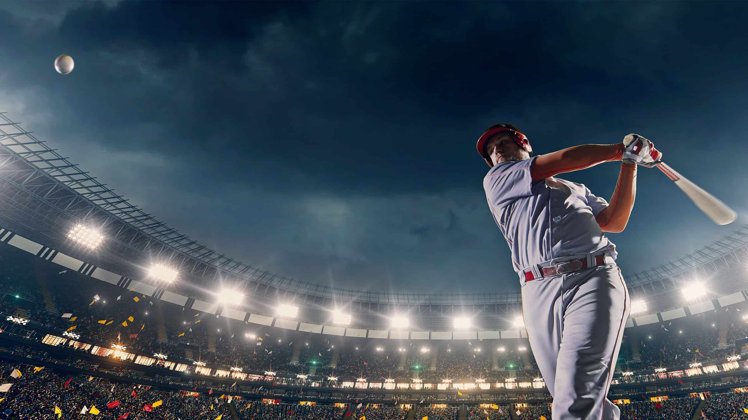 A male baseball player performs a dramatic play on the baseball stadium. He wears unbranded sport clothes. The stadium is made in 3D.