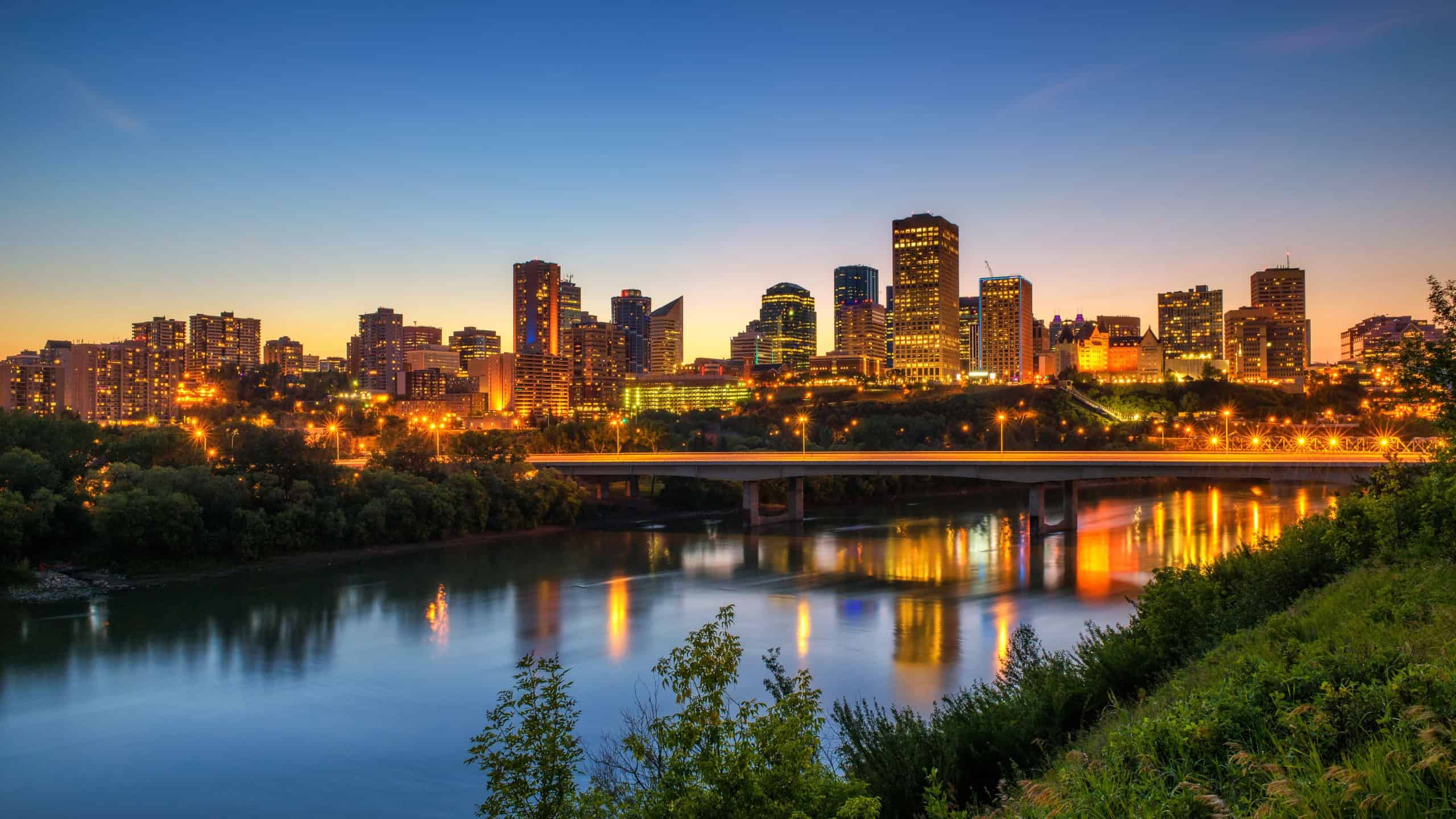 Edmonton downtown, James Macdonald Bridge and the Saskatchewan River at night, Alberta, Canada. Long exposure.