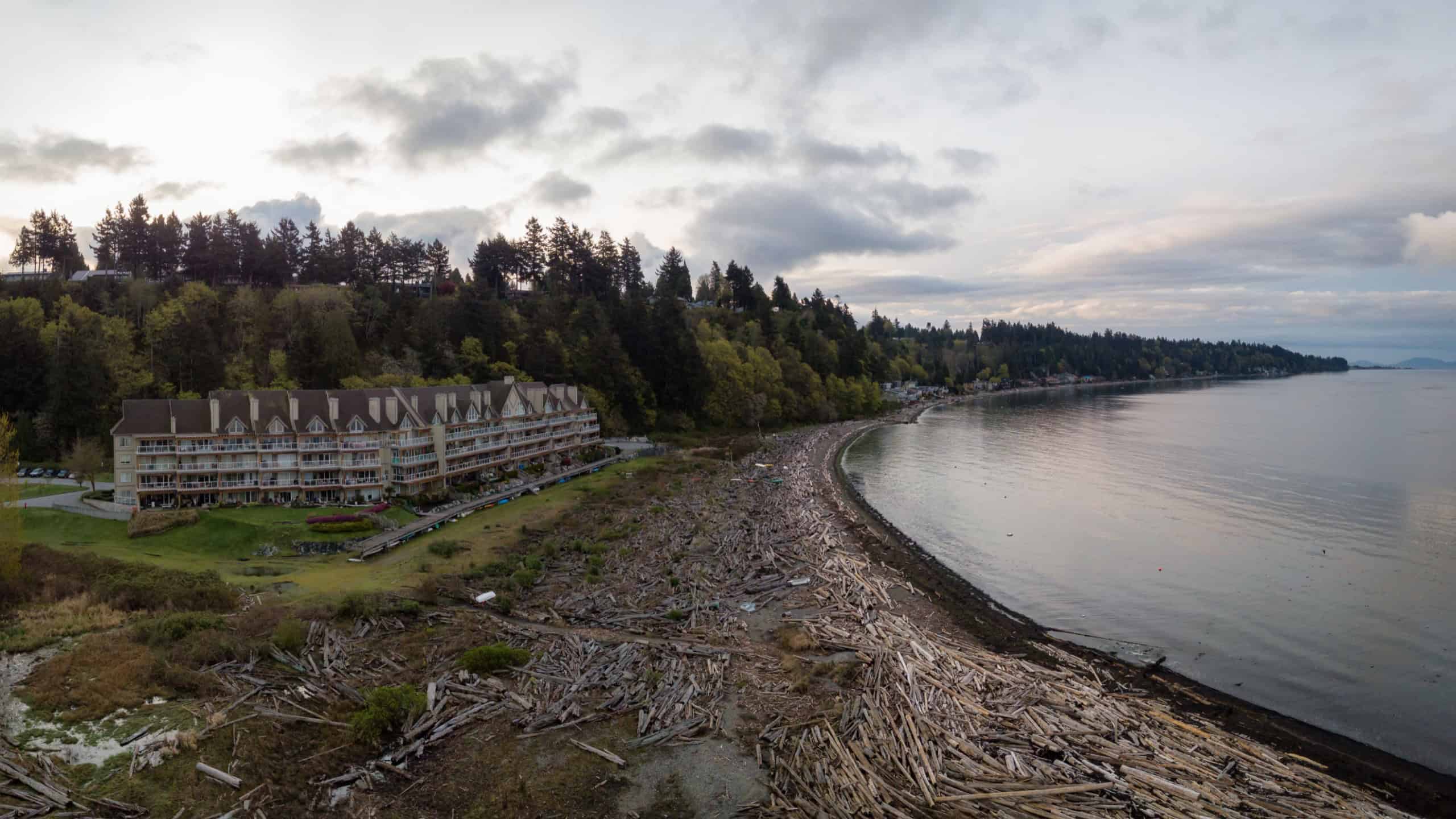 Aerial Panoramic view of a beach in Tsawwassen during a vibrant sunrise. Taken in Greater Vancouver, British Columbia, Canada.