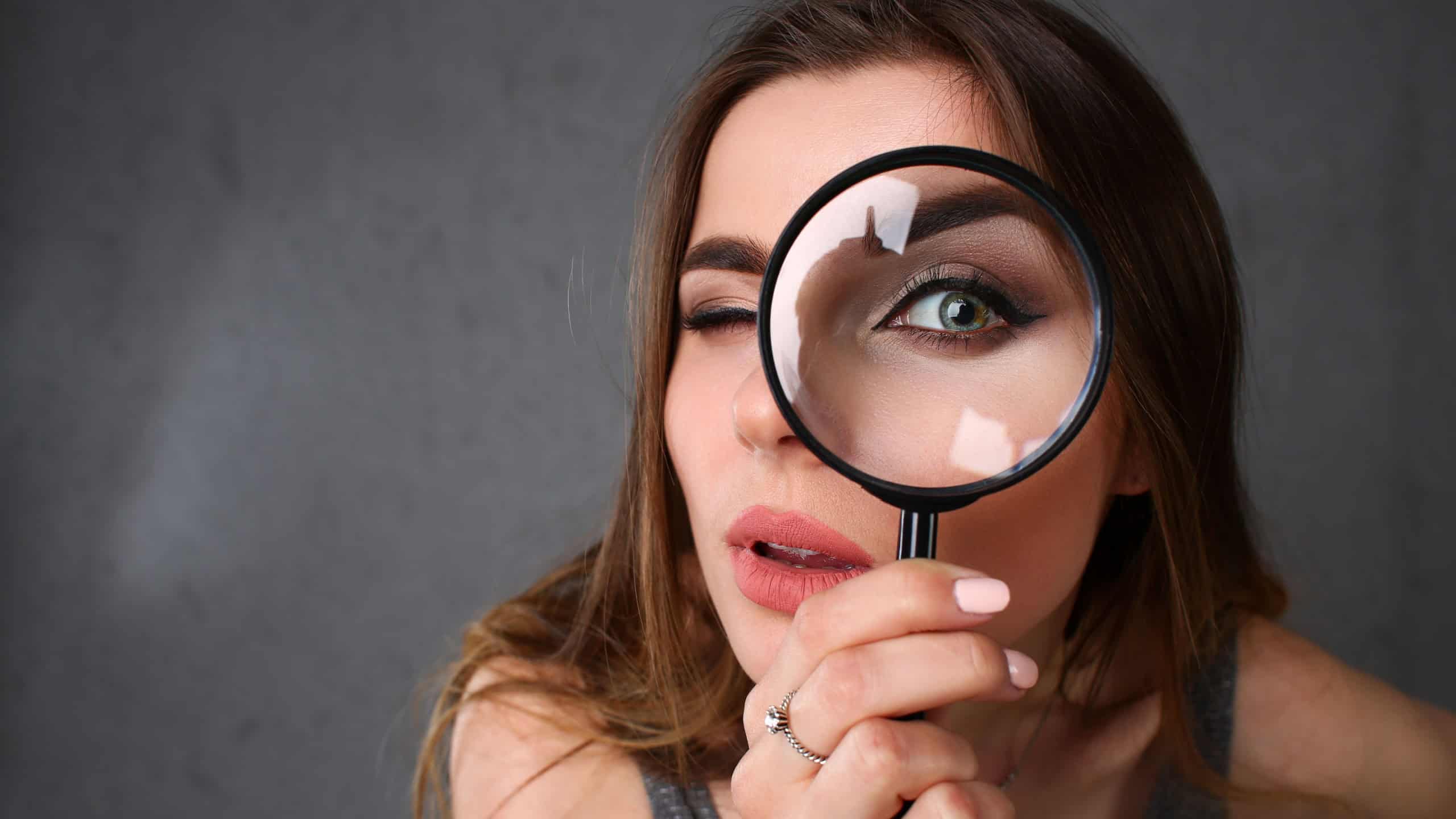 Young beautiful woman portrait looks painful eye lens search on Internet information employer does not find pop-up error 404 in browser issuing popular system queries unique selection optimization.