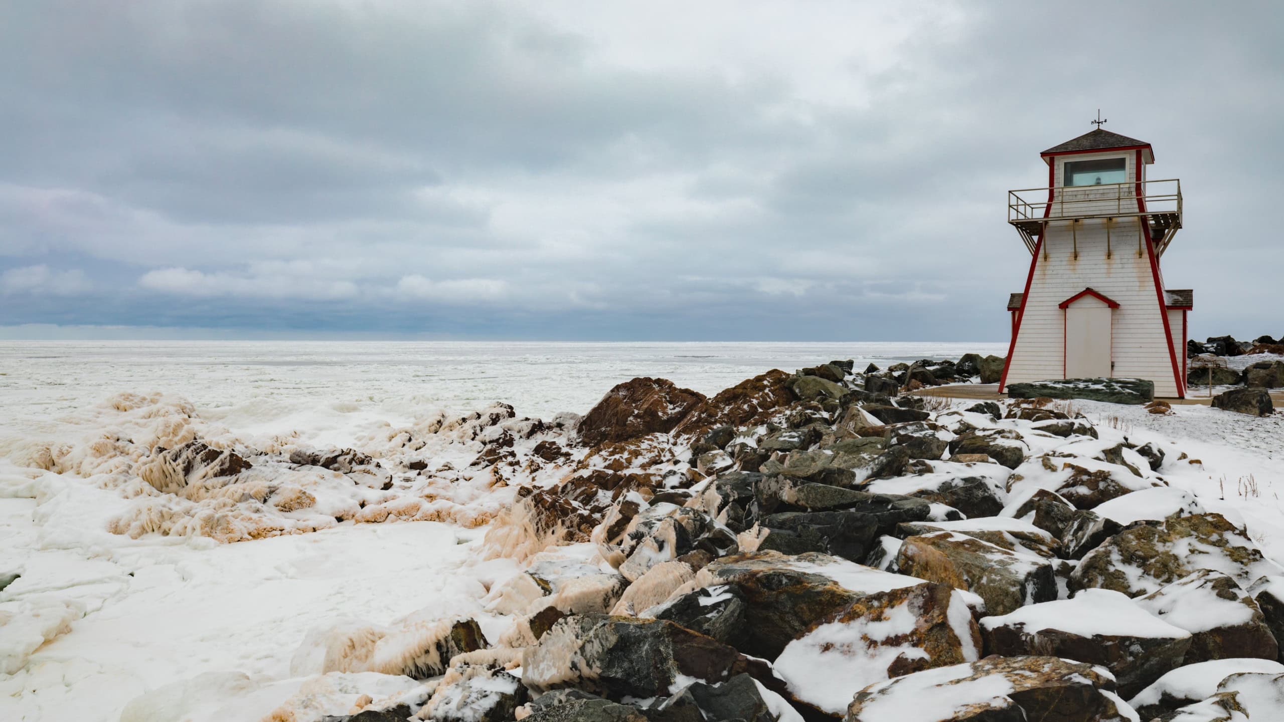 Frozen Atlantic Ocean off seashore at Arisaig Lighthouse in Antigonish County, Nova Scotia, NS, Canada
