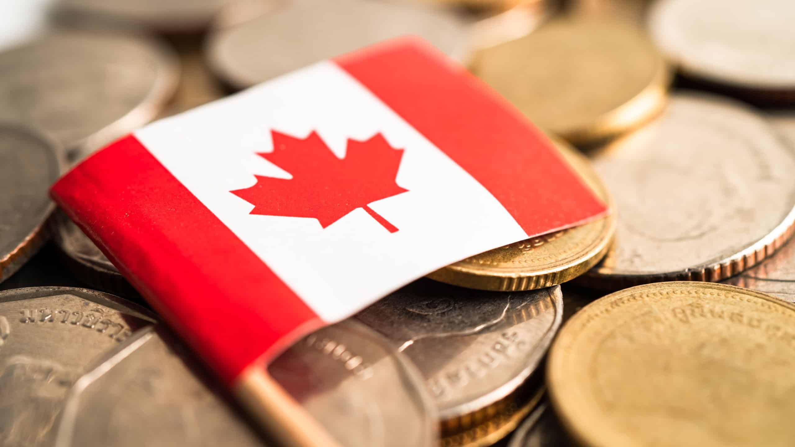 Stack of coins money with Canada flag, finance banking concept.