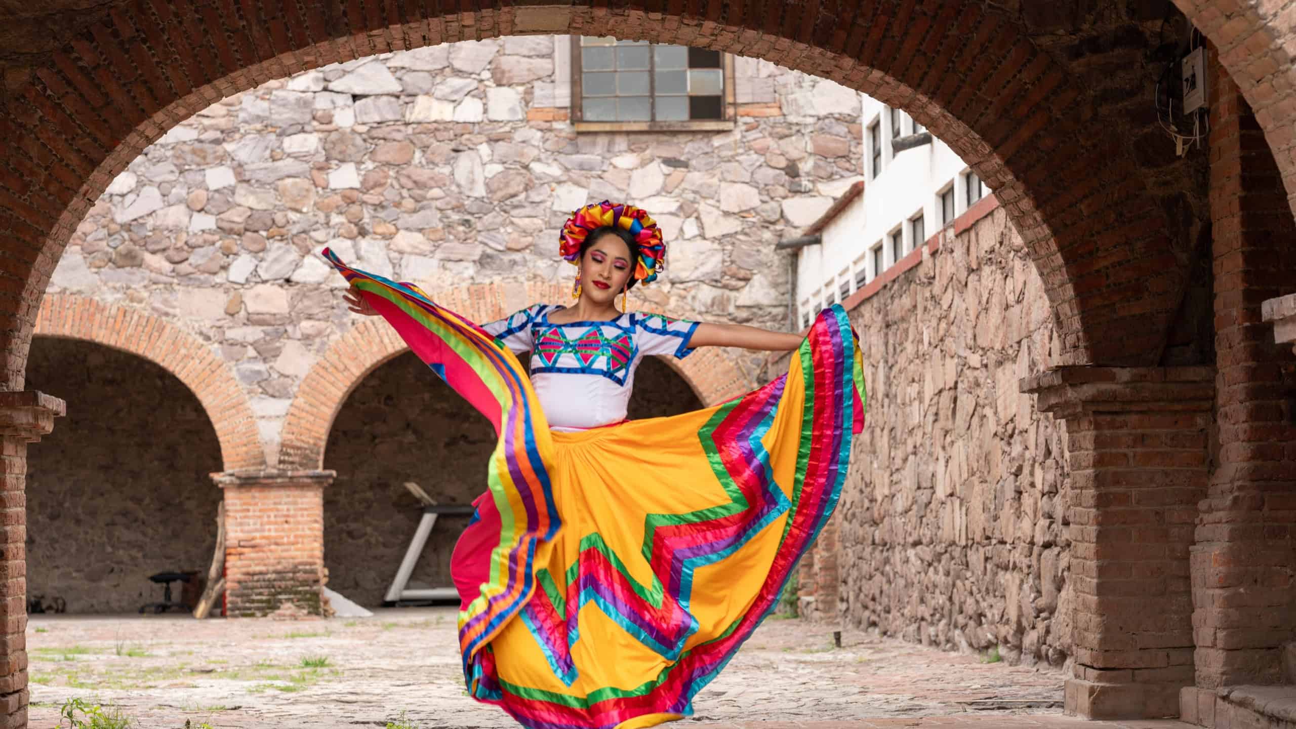 Pretty Young Woman Wearing traditional folkloric dress independence day or cinco de mayo parade or cultural Festival