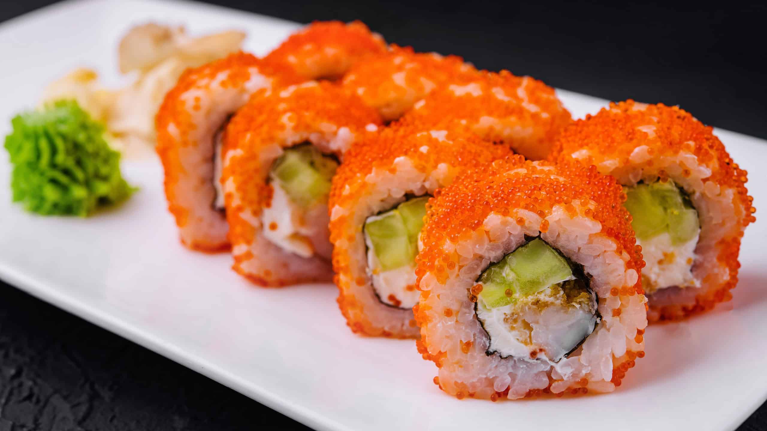 Macro shot of california maki sushi rolls with rice