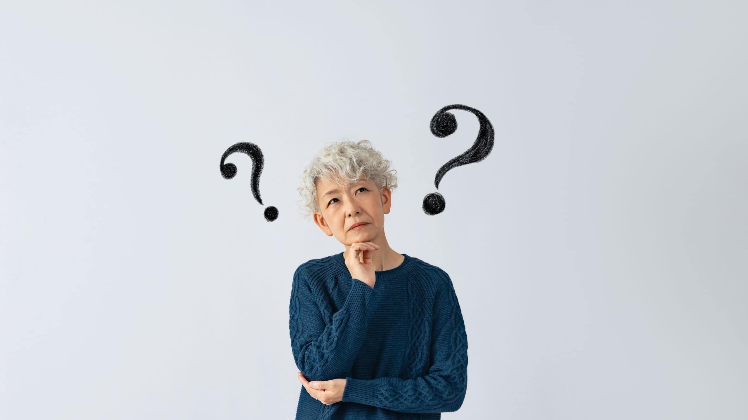 Asian senior woman having questions