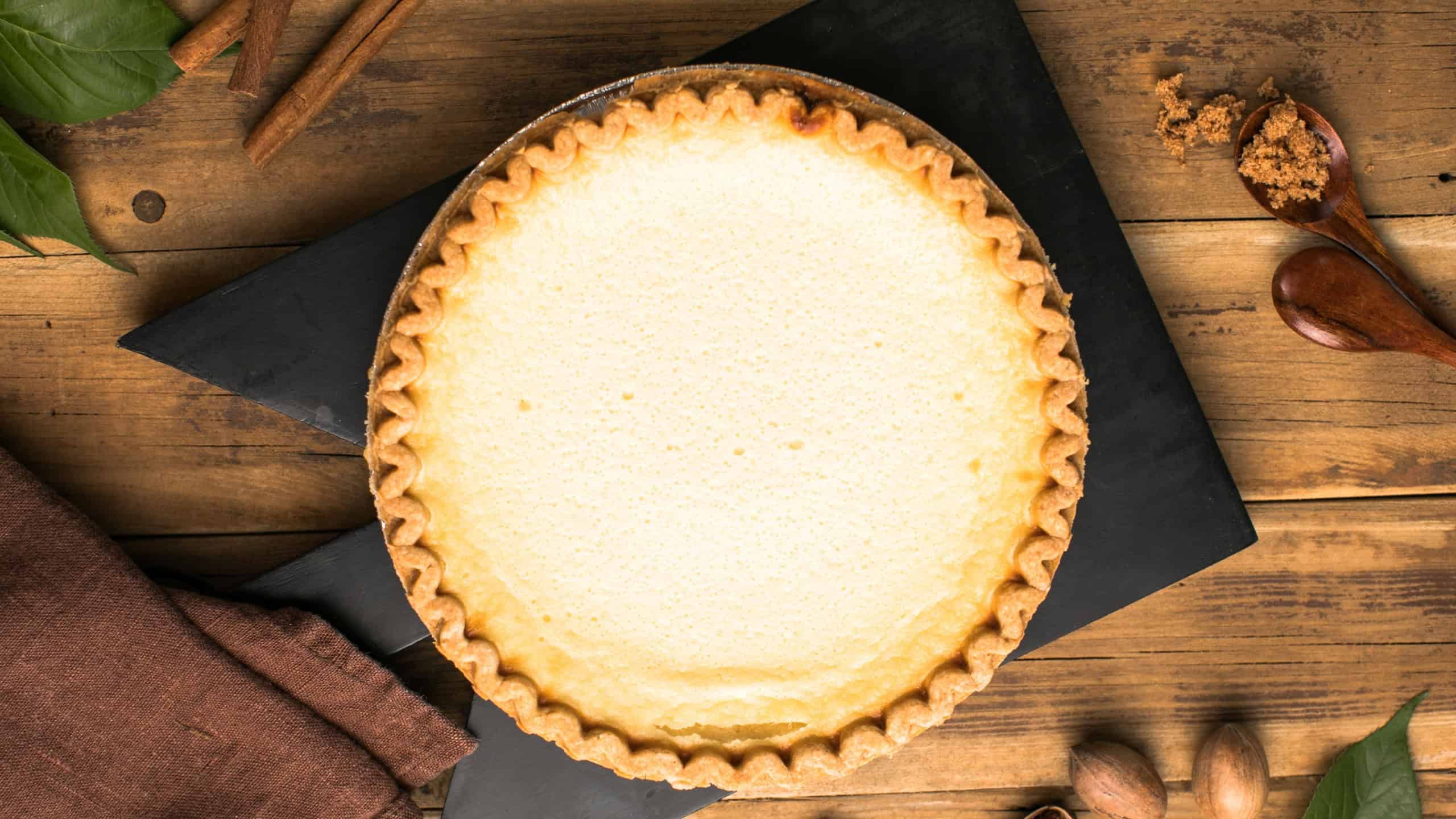 A freshly baked custard pie with eggs, milk, sugar, and vanilla.