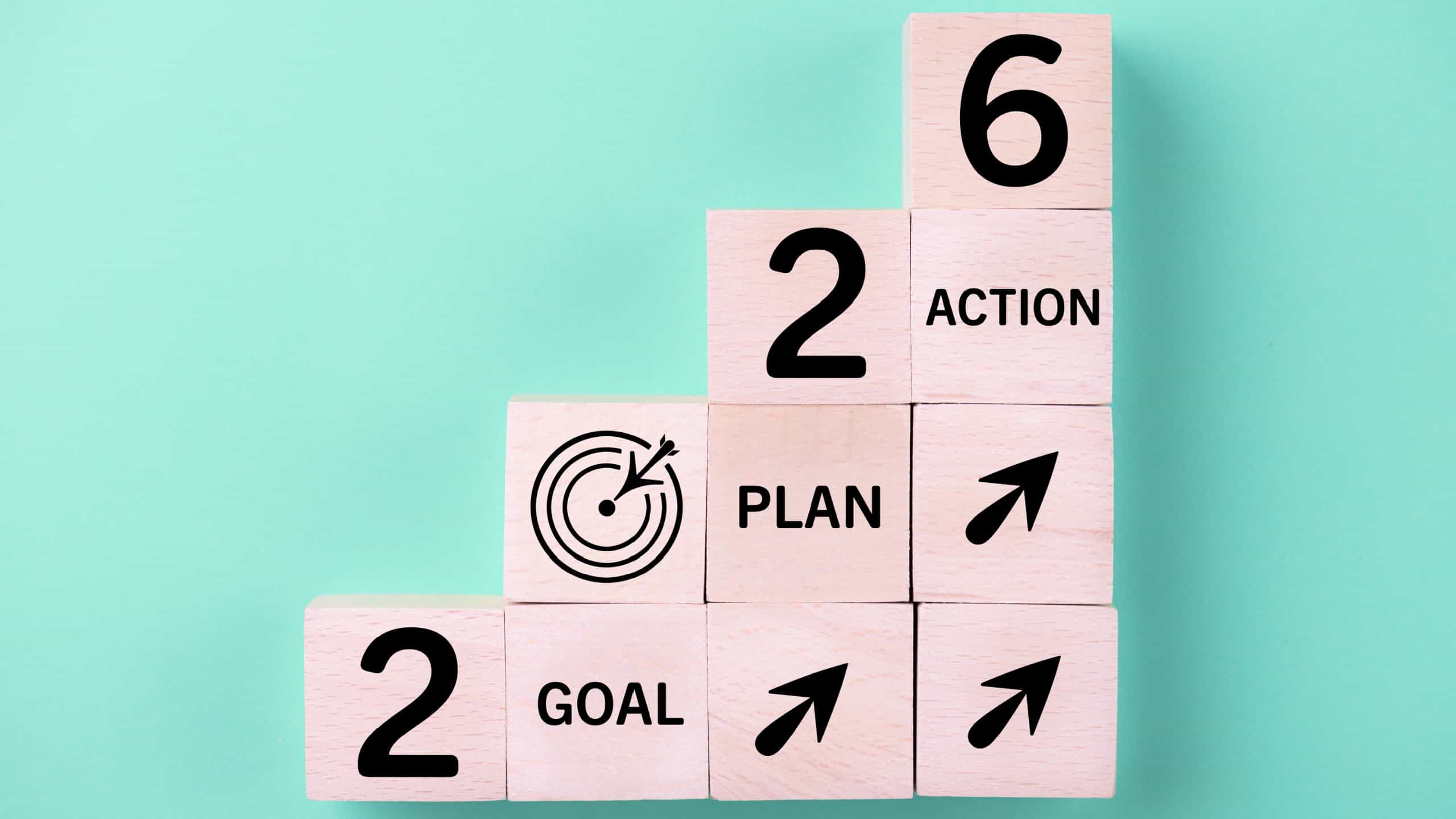 2026 New Year card. New Years goals 2026 with wooden cube, target icon. Concept 2026 New Year background. Goal, plan, action, business, resolutions, financial, success, ideas 