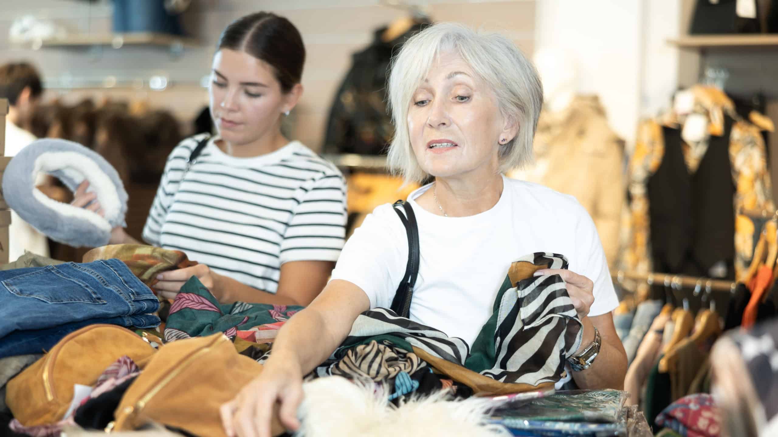 In thrift store, she carefully selects secondhand garment that speaks to her style.