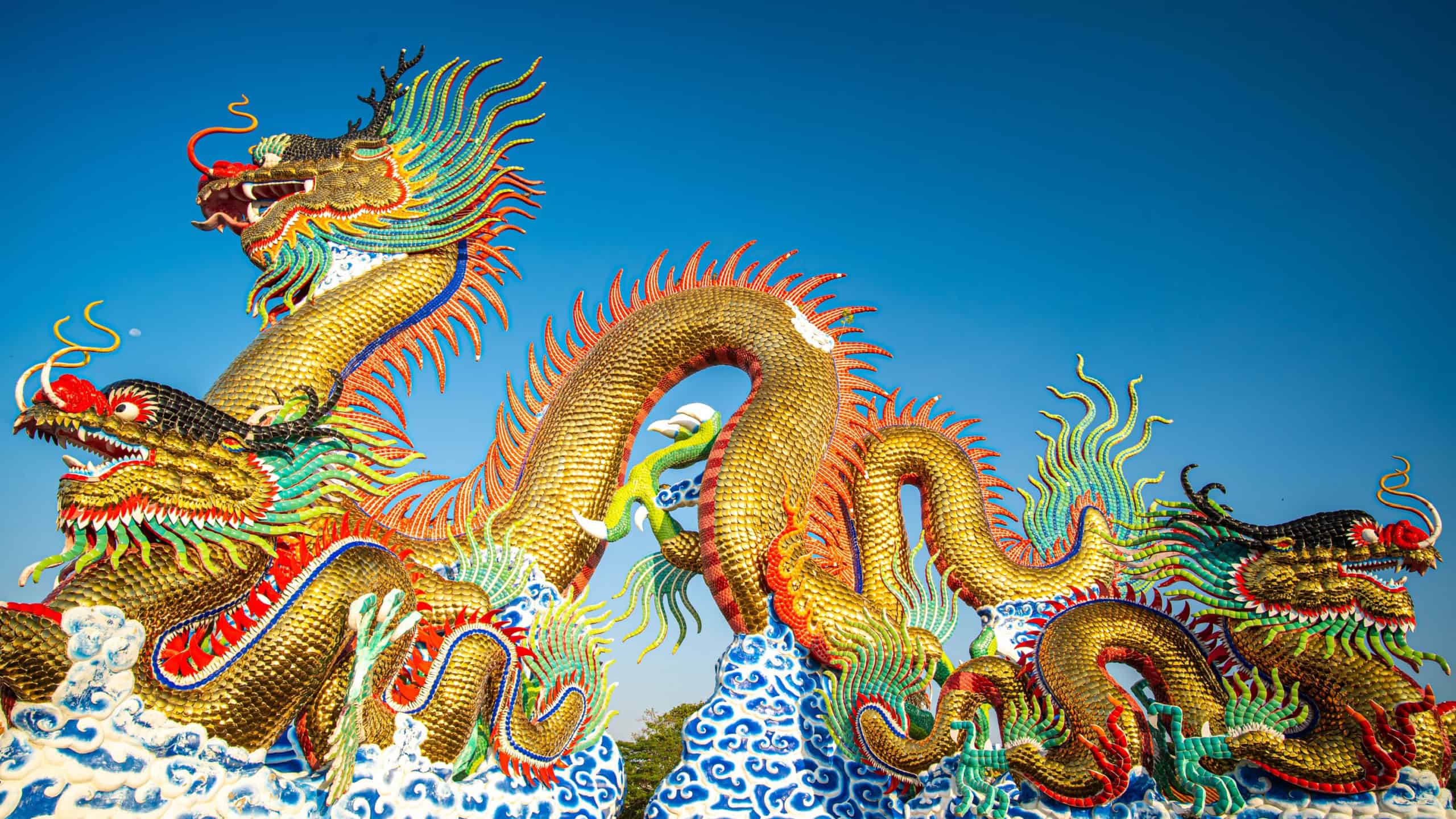 Colorful dragon statue morning sunrise against blue sky Chinese new year Nakornsawan Thailand