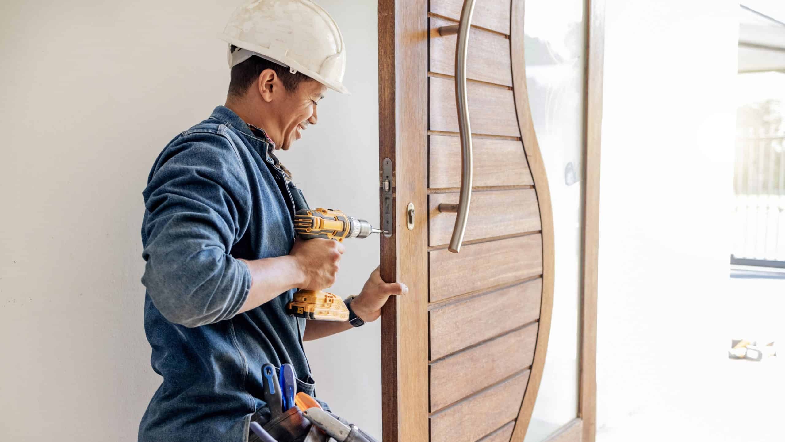 Locksmith, man and maintenance, handyman with home renovation and fixing, change door locks with power tools. Construction, building industry and trade with manual labour, vocation and employee