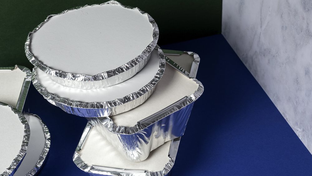 Empty aluminum take away food containers. Recycling concept
