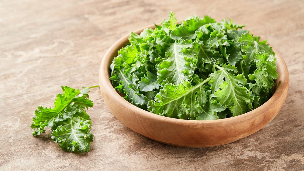 Kale leaves vegetable on wooden background